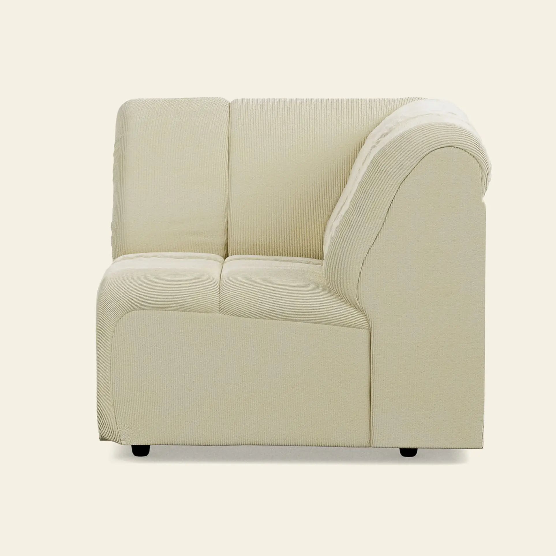 The HKliving Wave Couch, Corner by HKliving is a beige upholstered sectional seat with rounded armrest and backrest. This modern sofa fits perfectly into any living room, shown here against a plain light background.