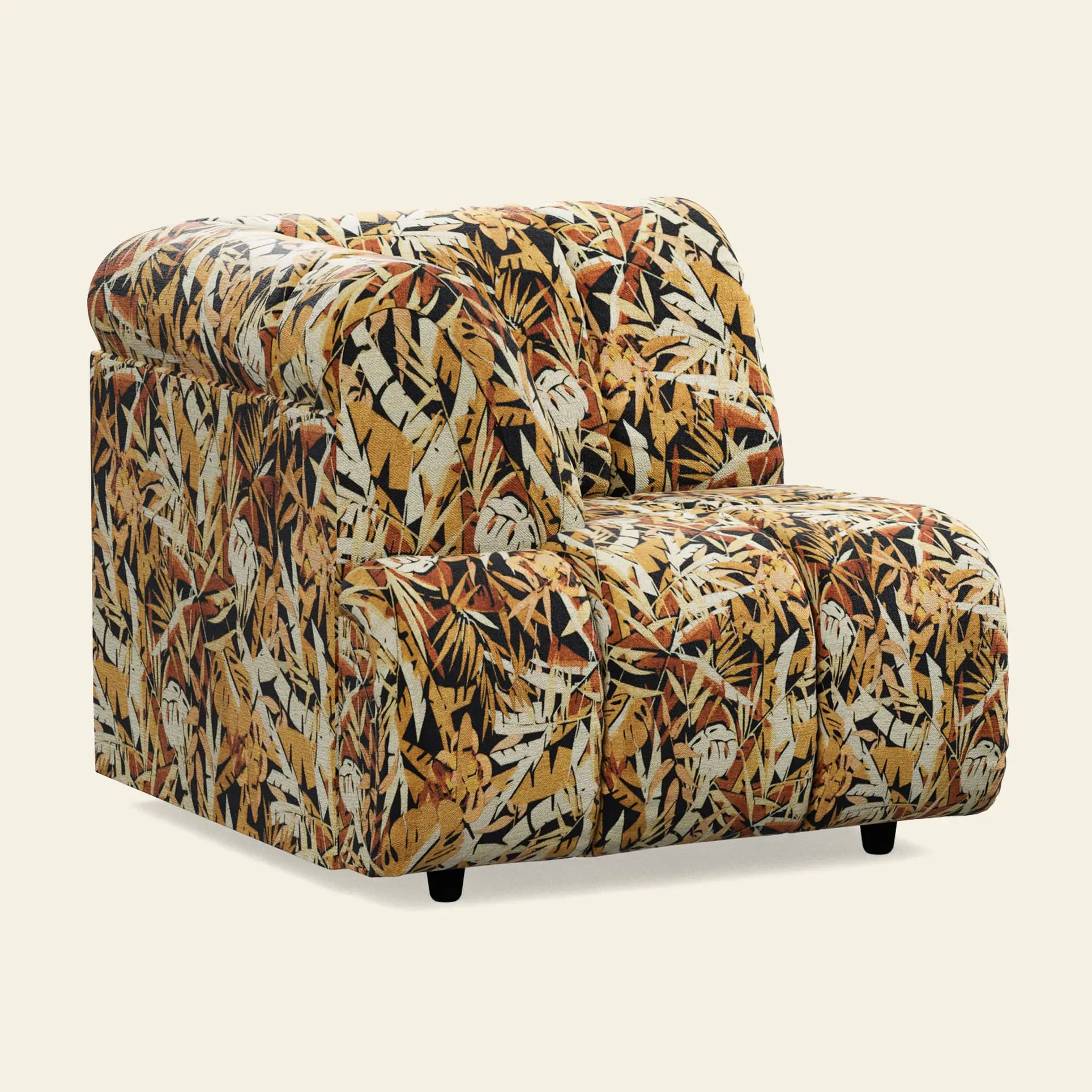 This armless accent chair features a vibrant jungle print in yellow, orange, brown, and white with a plush cushioned seat and low black legs—ideal to pair with the HKliving Wave Couch, Left High Arm by HKliving.