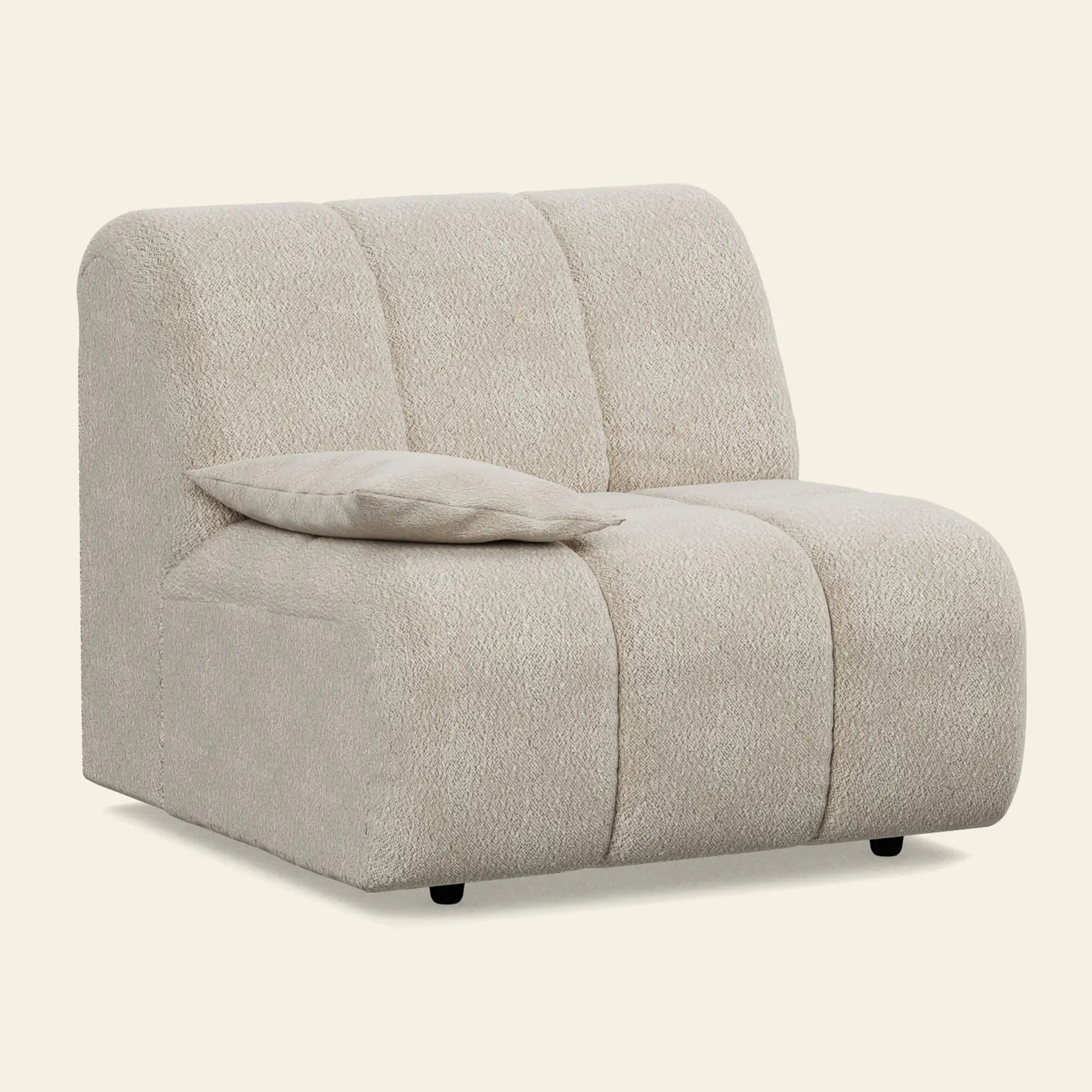 The HKliving Wave Couch, Left Low Arm by HKliving is a modern armless accent chair upholstered in textured beige fabric with vertical stitching and a matching cushion—ideal for elevating any living room alongside your modern couch.