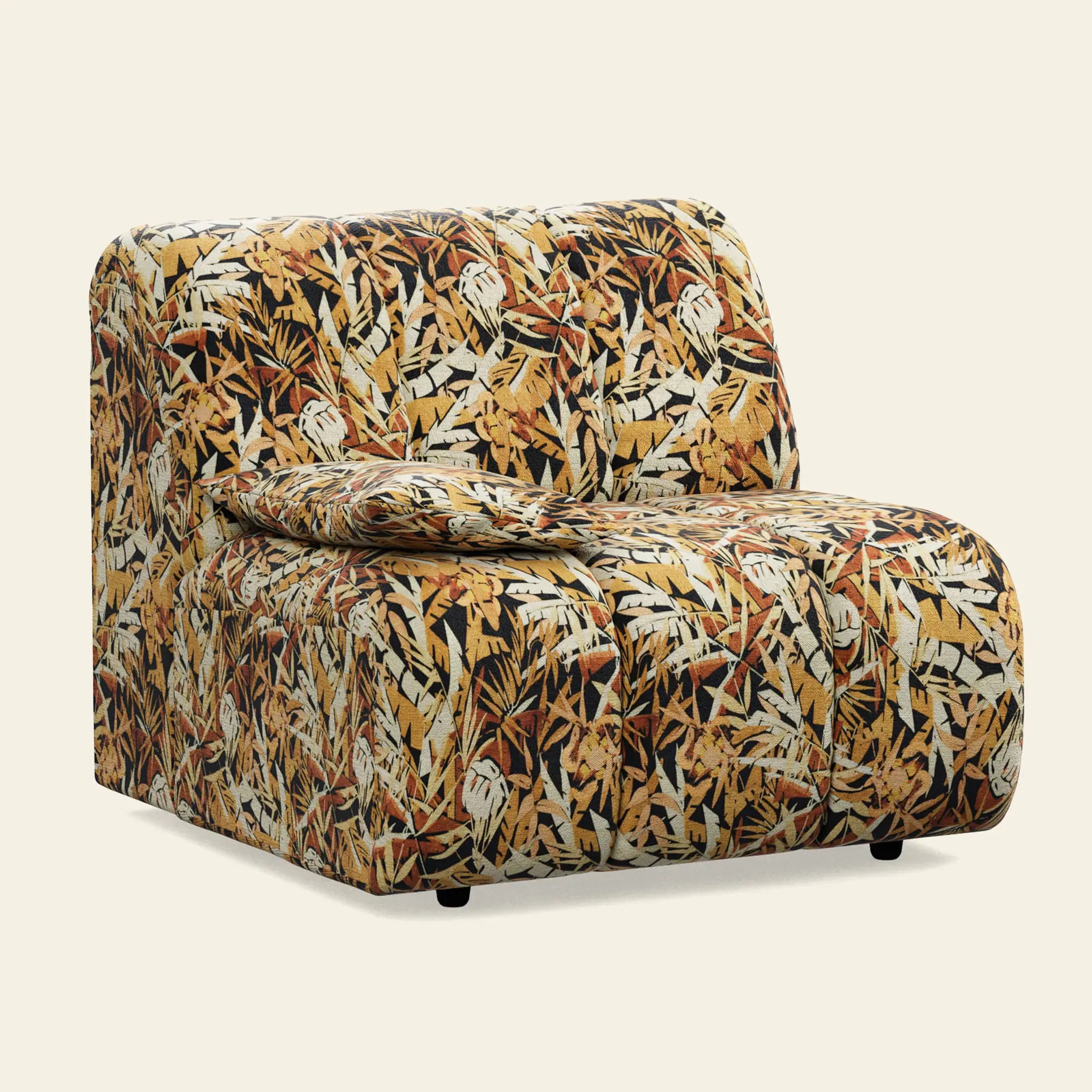The HKliving Wave Couch, Left Low Arm by HKliving features a bold, contemporary jungle print with multicolored leaves—yellow, orange, brown, and black—on a light background. Includes a matching cushion and modern armless design.
