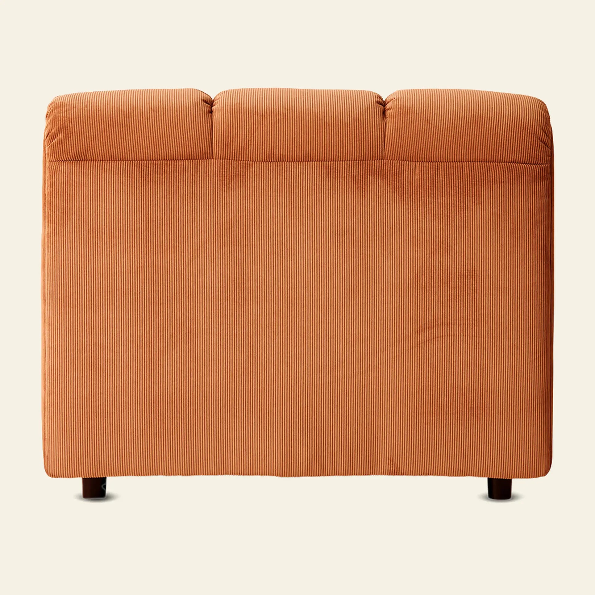 A back view of the HKliving Wave Couch, Middle by HKliving in orange corduroy, inspired by 1970s design, featuring three seat cushions, short black legs, and a simple silhouette against a plain light background.