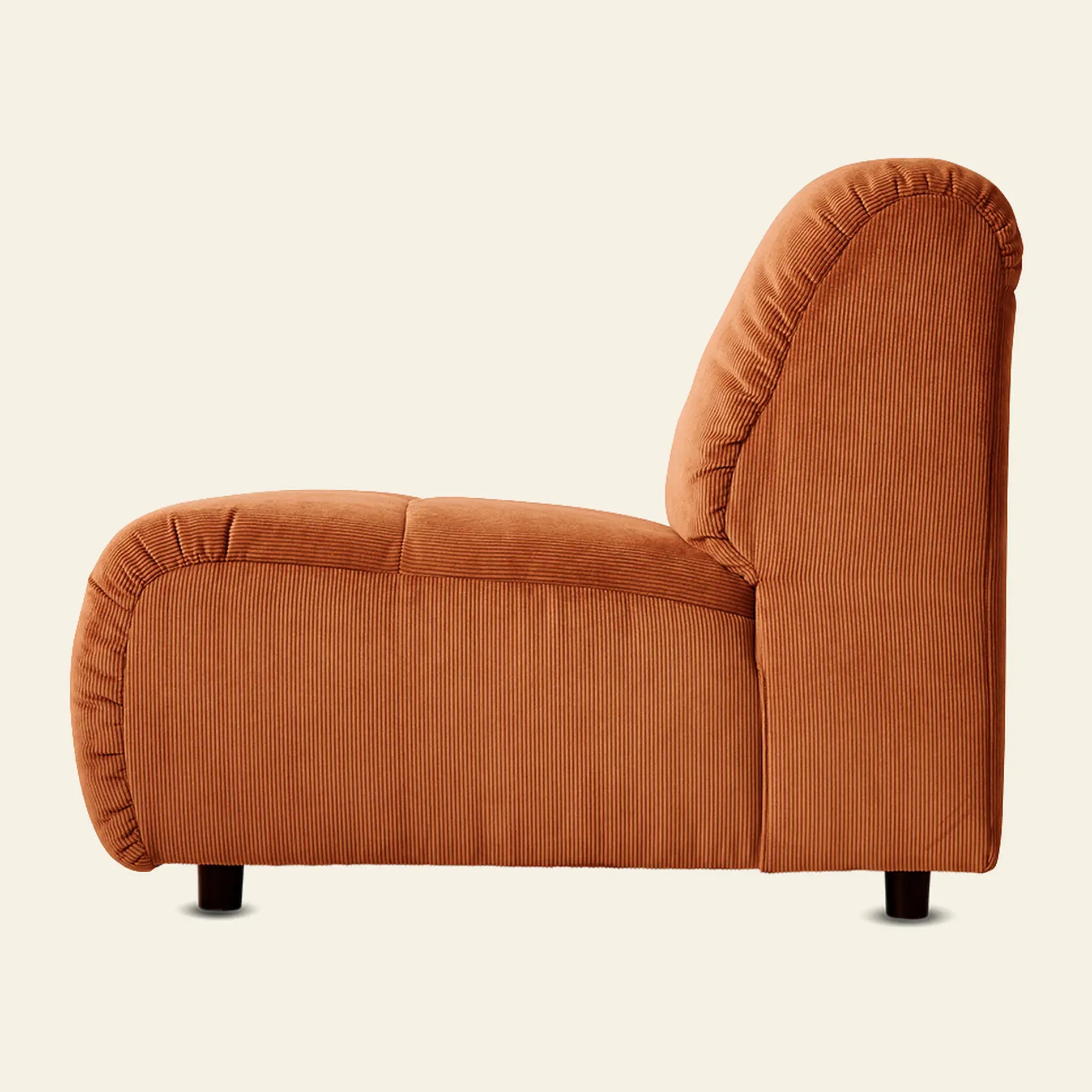 Side view of the HKliving Wave Couch, Middle Small by HKliving—an orange corduroy upholstered armchair with plush, rounded 1970s-inspired design and short black legs, displayed against a plain beige background.