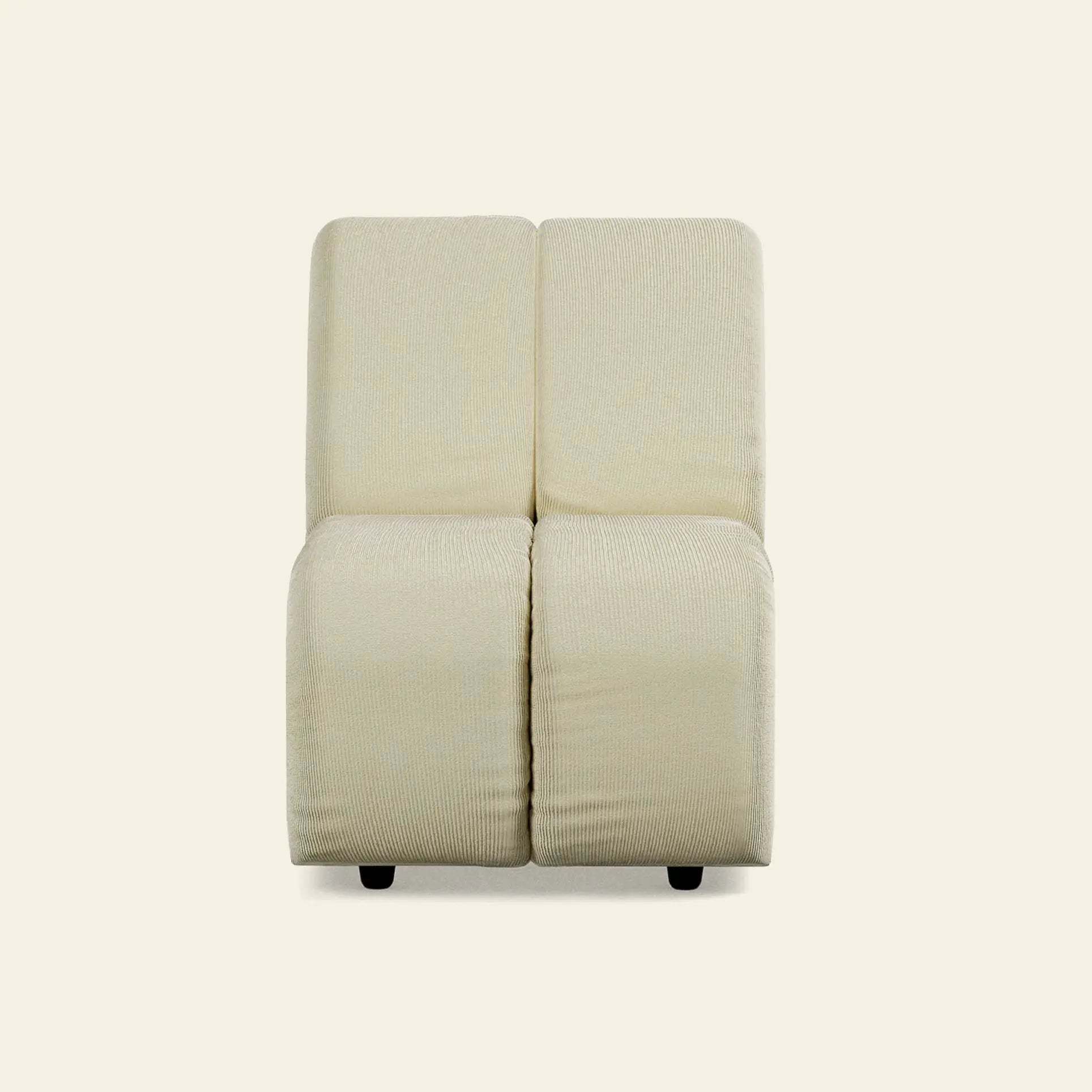 The HKliving Wave Couch, Middle Small, by HKliving is a cream-colored armchair with 1970s-inspired minimalist design, textured fabric, and two-tone seat and back. Displayed front-facing against a beige background on short black legs.