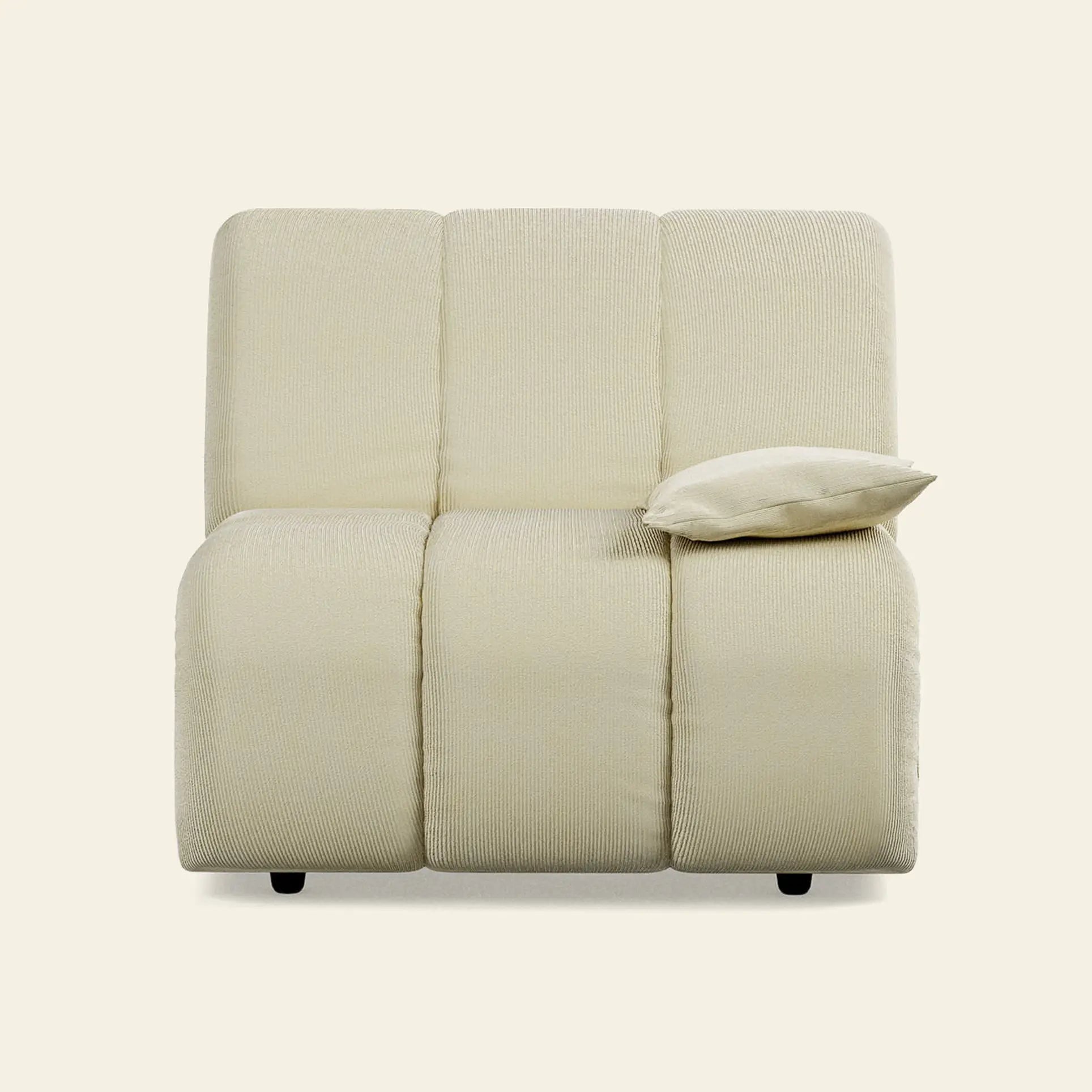 The HKliving Wave Couch, Right Low Arm by HKliving features a modern light beige design with three vertical cushions and a matching right-side pillow—ideal for enhancing your living room décor.