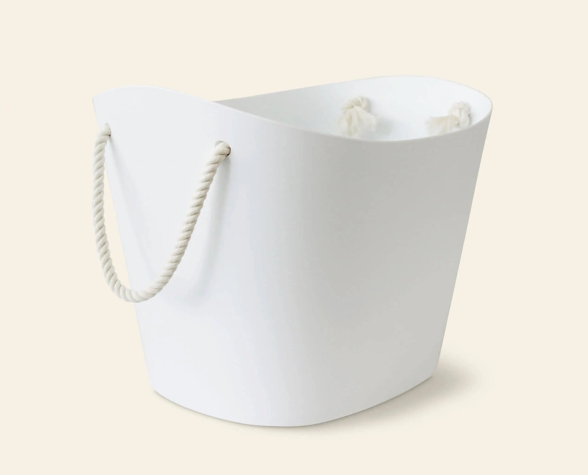 The Hachiman Balcolore Storage Basket M by Hachiman features a white, oval design with thick twisted rope handles, adding minimalist Japanese style and versatile storage to any space.