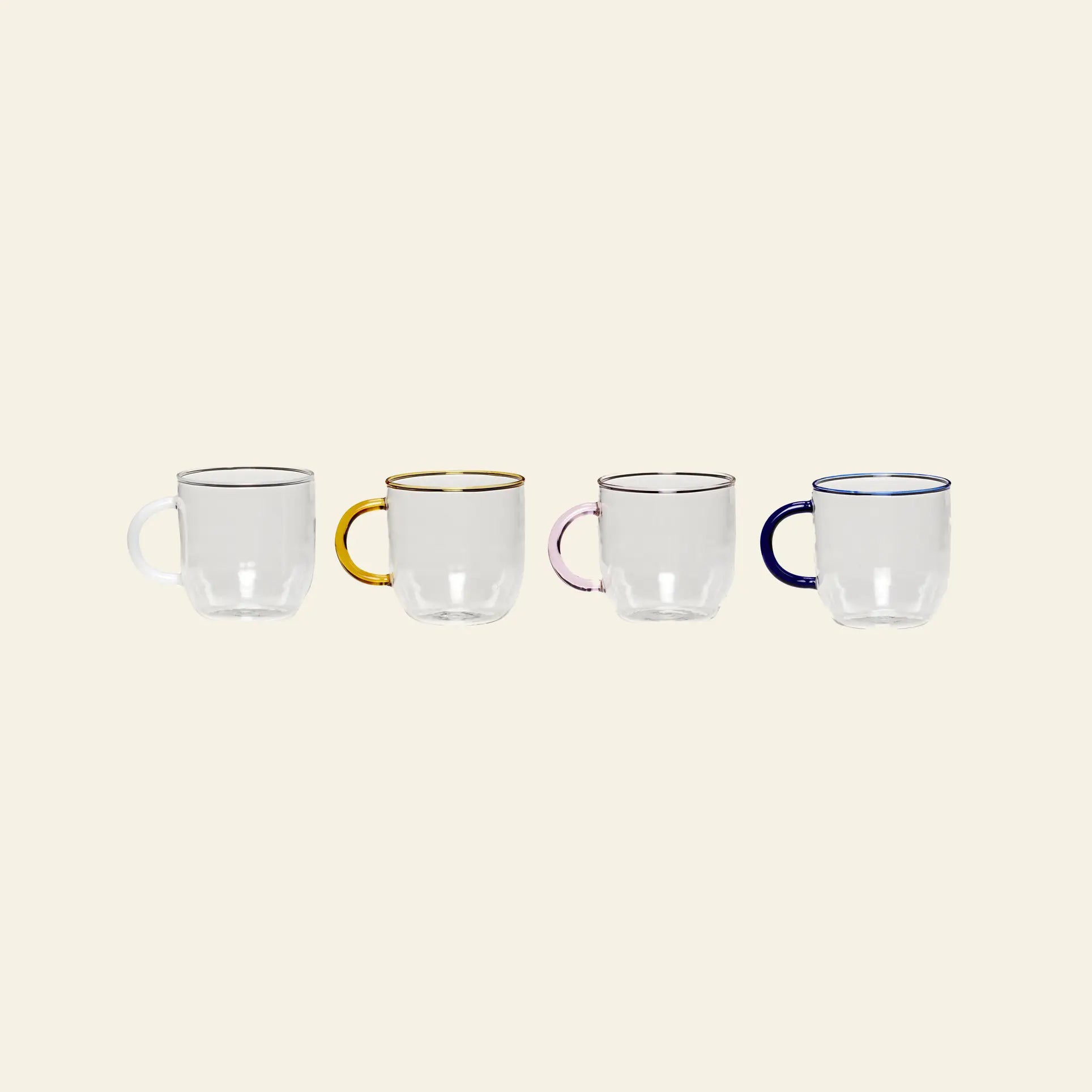 Four Hübsch Kiosk Glass Mugs by Hübsch are lined up side by side, each handmade with a clear body and colorful handles and rims—clear, gold, pink, and navy blue—against a neutral beige background.