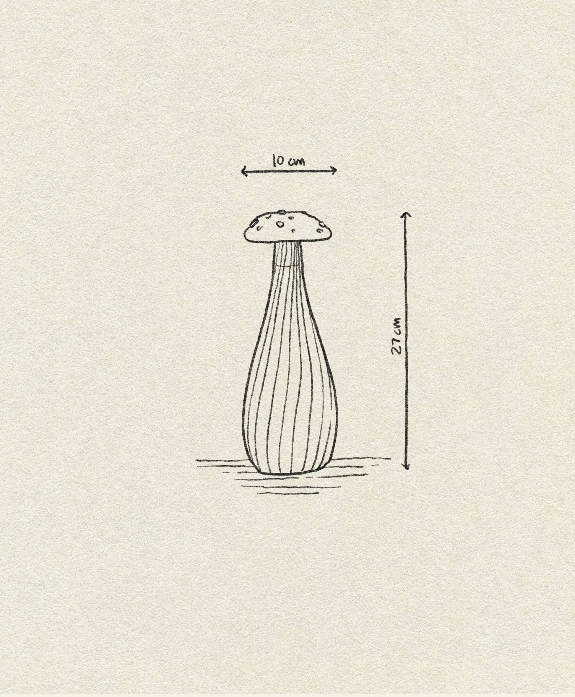 A whimsical line drawing of a tall, ribbed-stem mushroom (27 cm high, 10 cm wide cap) from the Alice collection features on textured paper, inspired by the Ichendorf Milano Alice Bottle by Ichendorf Milano.