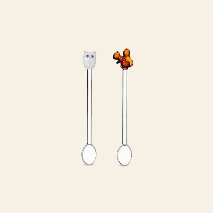 The Ichendorf Milano Animal Farm Spoons, Set of 2 by Ichendorf Milano features silver spoons with charming animal figures—a white owl and a brown squirrel—on their handles, shown against a plain light beige background.