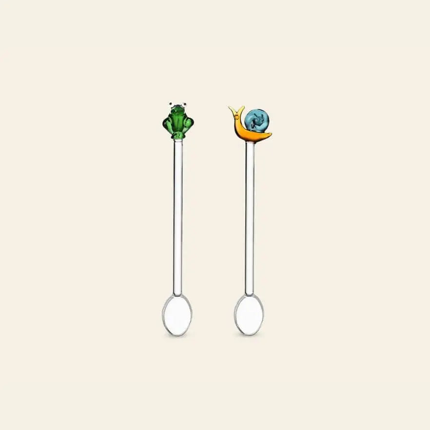The Ichendorf Milano Animal Farm Spoons, Set of 2, by Ichendorf Milano feature charming green frog and blue-shelled snail figures on the handles, adding playful character to your glassware collection.