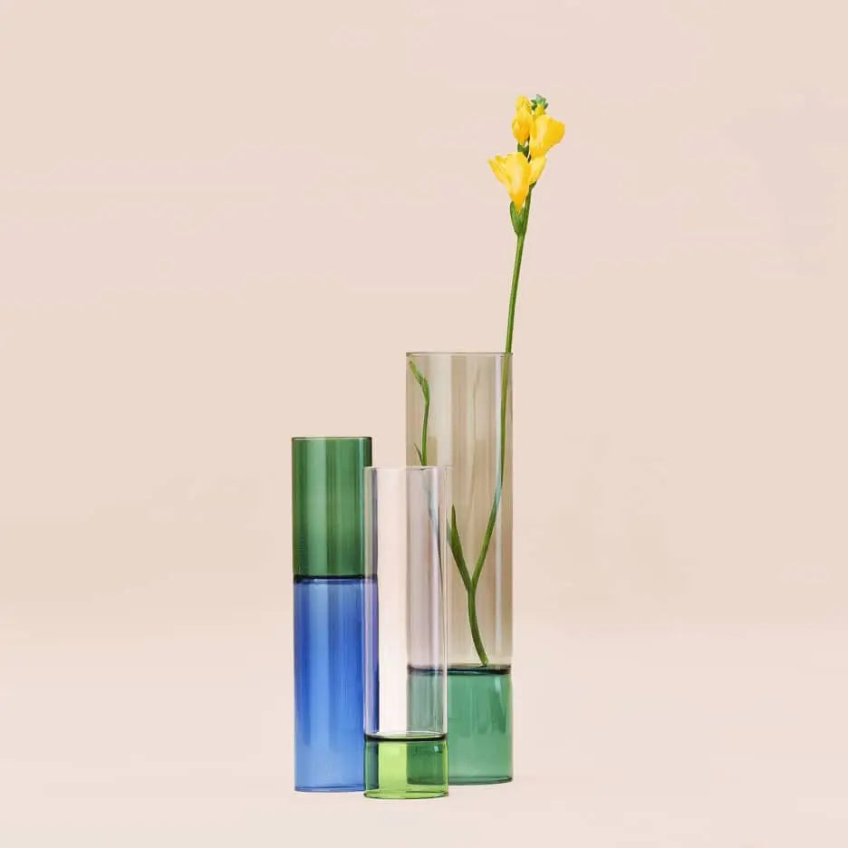 The Ichendorf Milano Bamboo Groove Vase 30cm by Ichendorf Milano stands tall in clear glass, displaying a single yellow flower with green stem that appears to float against a plain beige background.