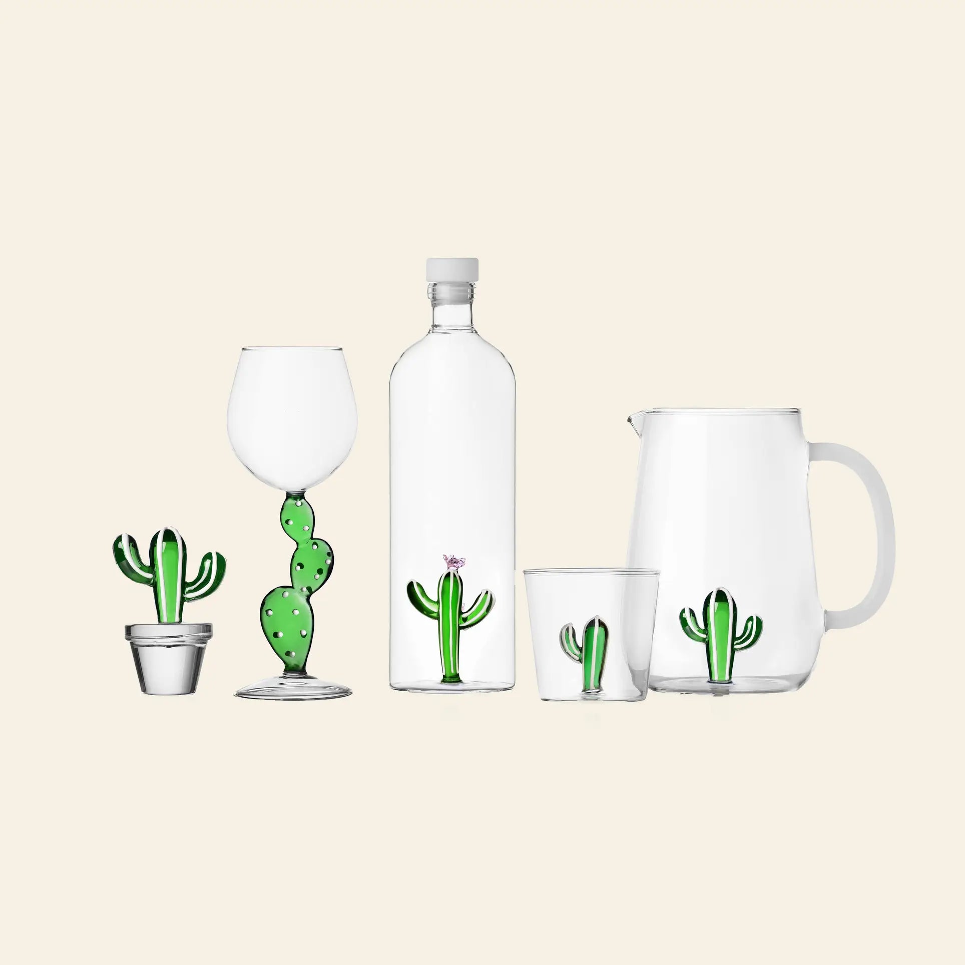 Part of the Desert Plants collection by Ichendorf Milano, the Ichendorf Milano Desert Plants Pitcher is a handcrafted glass pitcher featuring a playful cactus motif on a simple beige background.