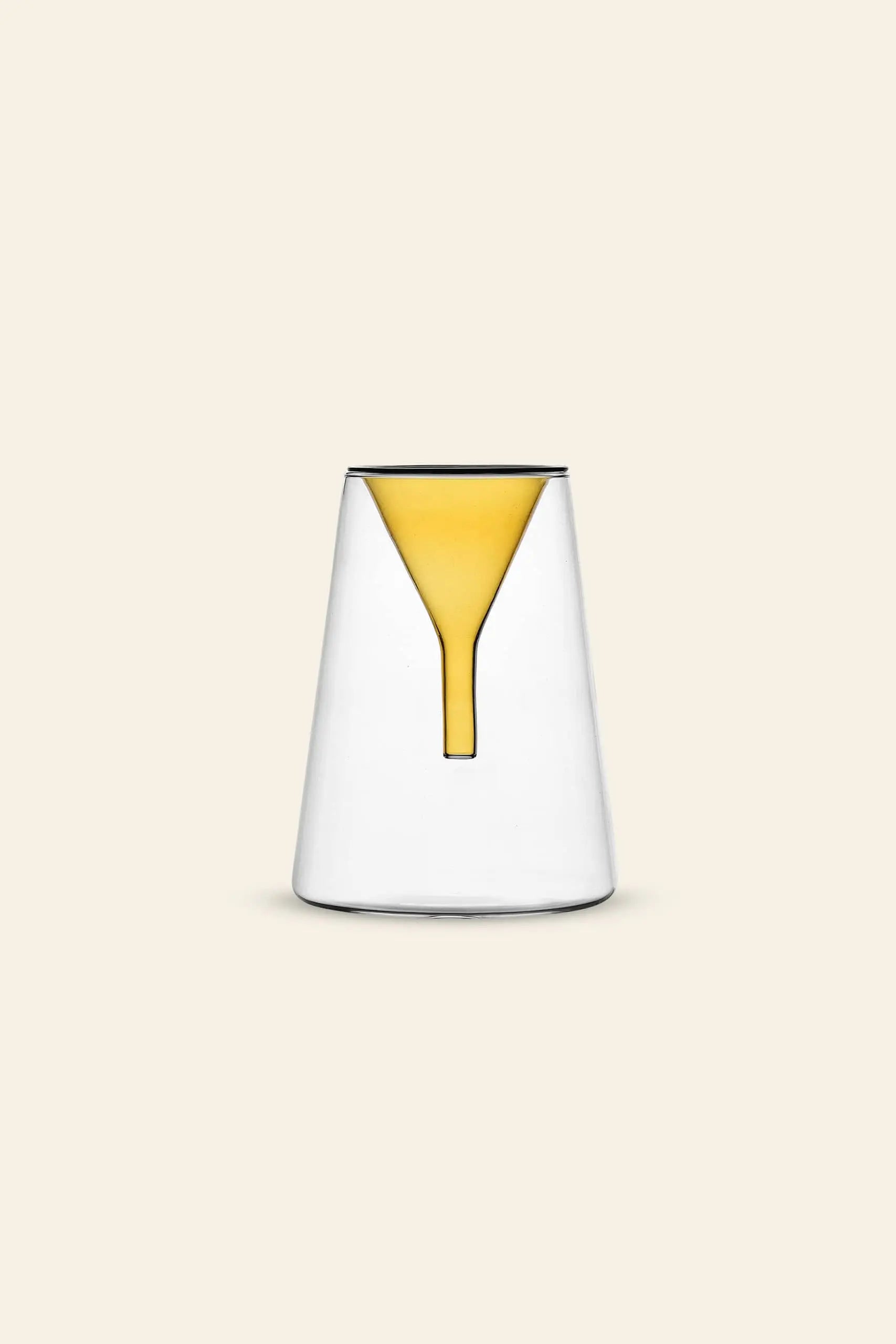 The Ichendorf Milano Kado Single Flower Vase 20cm by Ichendorf Milano, hand-flamed glass with a wide base and narrow top, is shown on a beige background with yellow liquid forming an inverted funnel inside, evoking its signature Kado design.