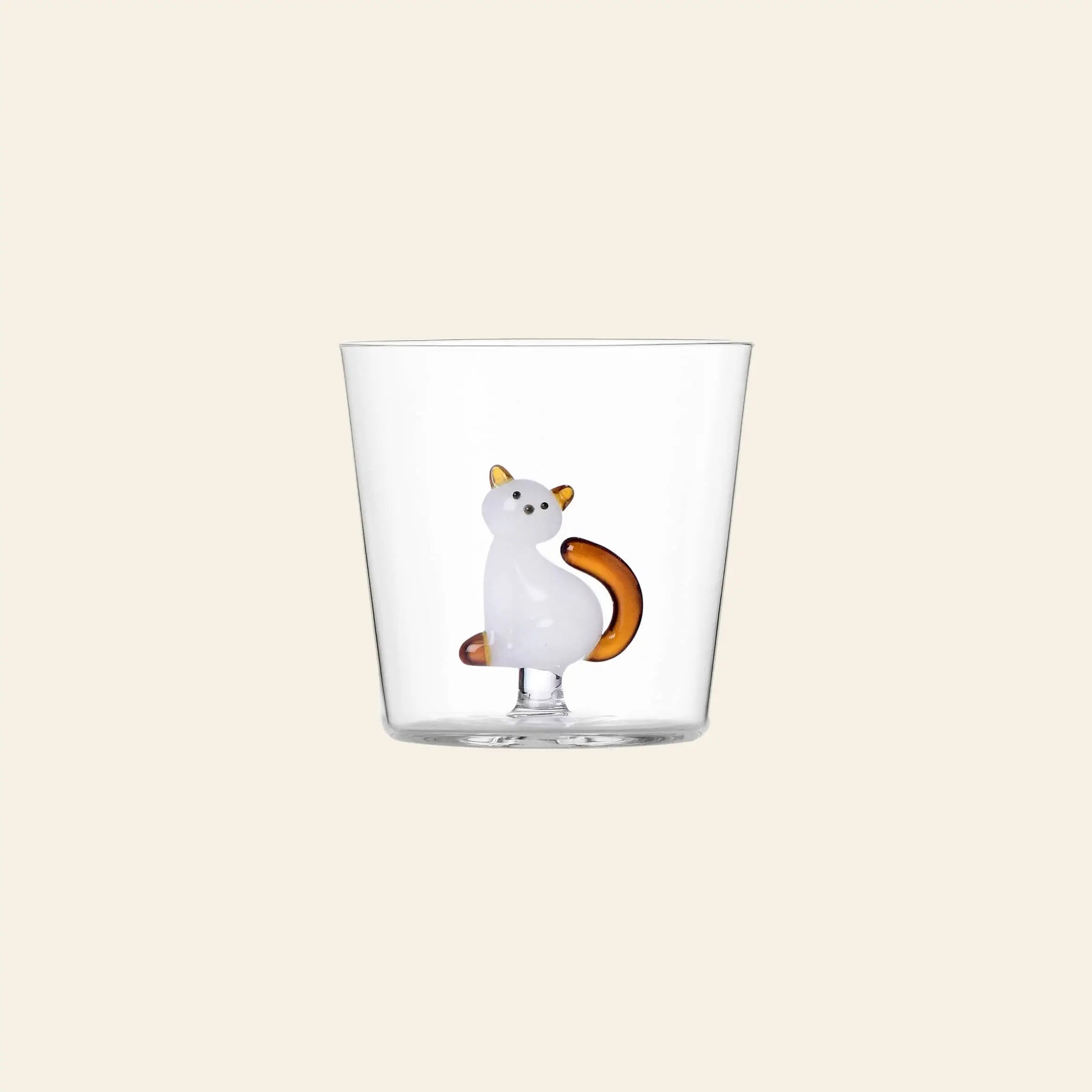 The Ichendorf Milano Tabby Cat Tumbler features a small white and orange cat figurine standing upright at the base—a perfect glass for cat lovers from the iconic Ichendorf Milano collection.
