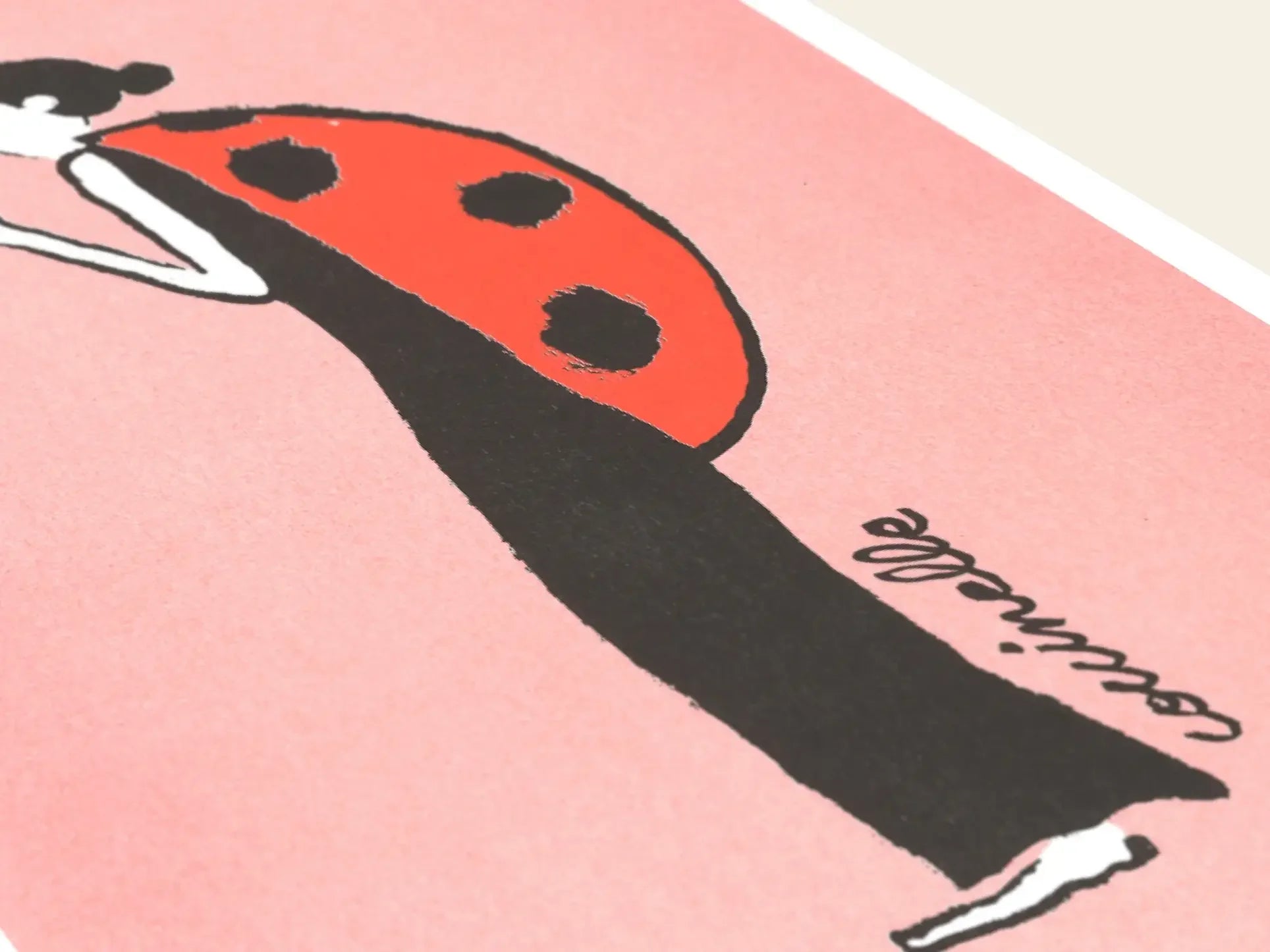 KIBLIND Ateliers “Jean Jullien - Ladybug” features a risography-inspired illustration of a person in a long black dress with a red ladybug shell on a pink background, with coccinelle in cursive.