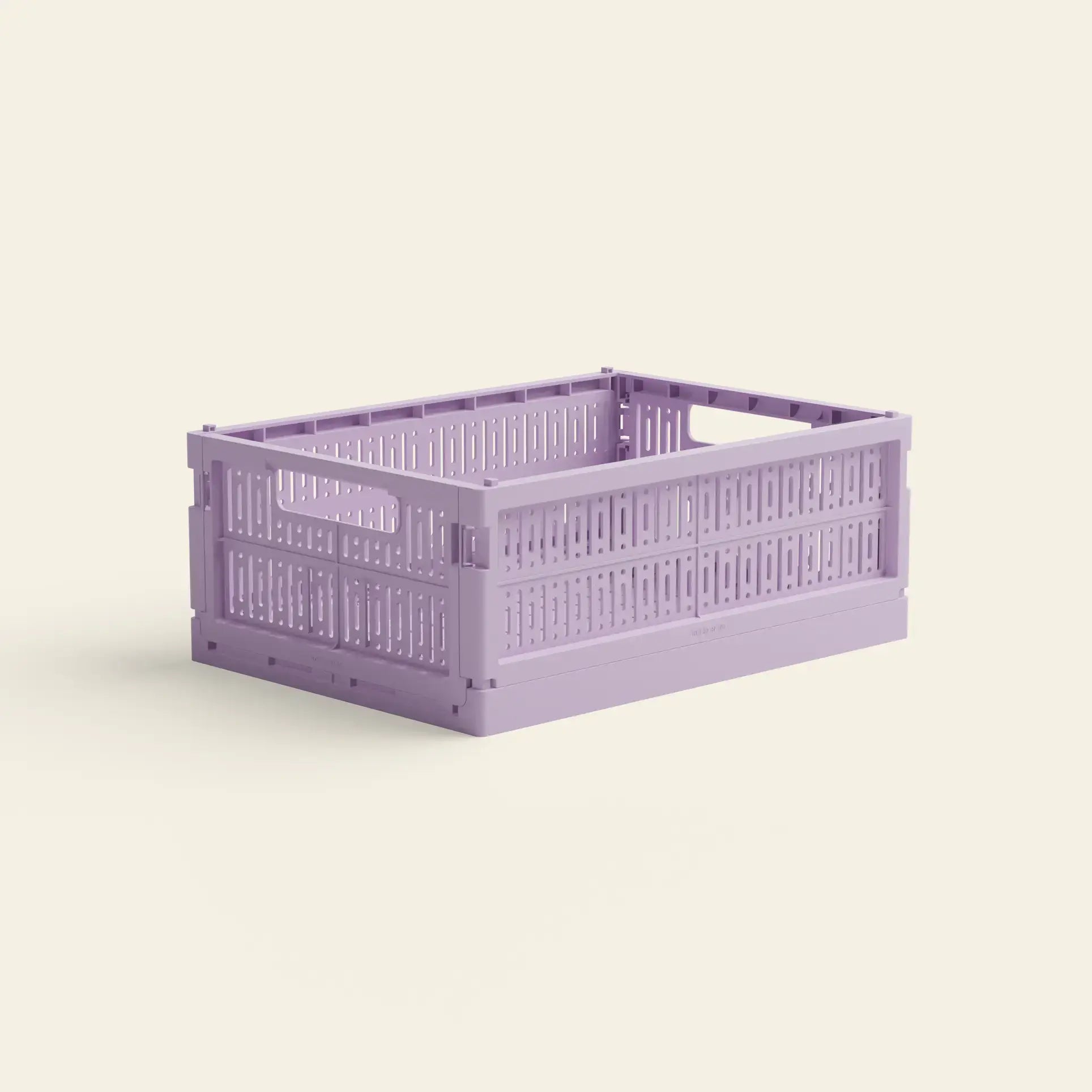 The Made Crate Midi by Made Crate is a rectangular, lavender recycled plastic storage crate with ventilated sides, handles at each end, and stackable design—perfect for any plain, light background.