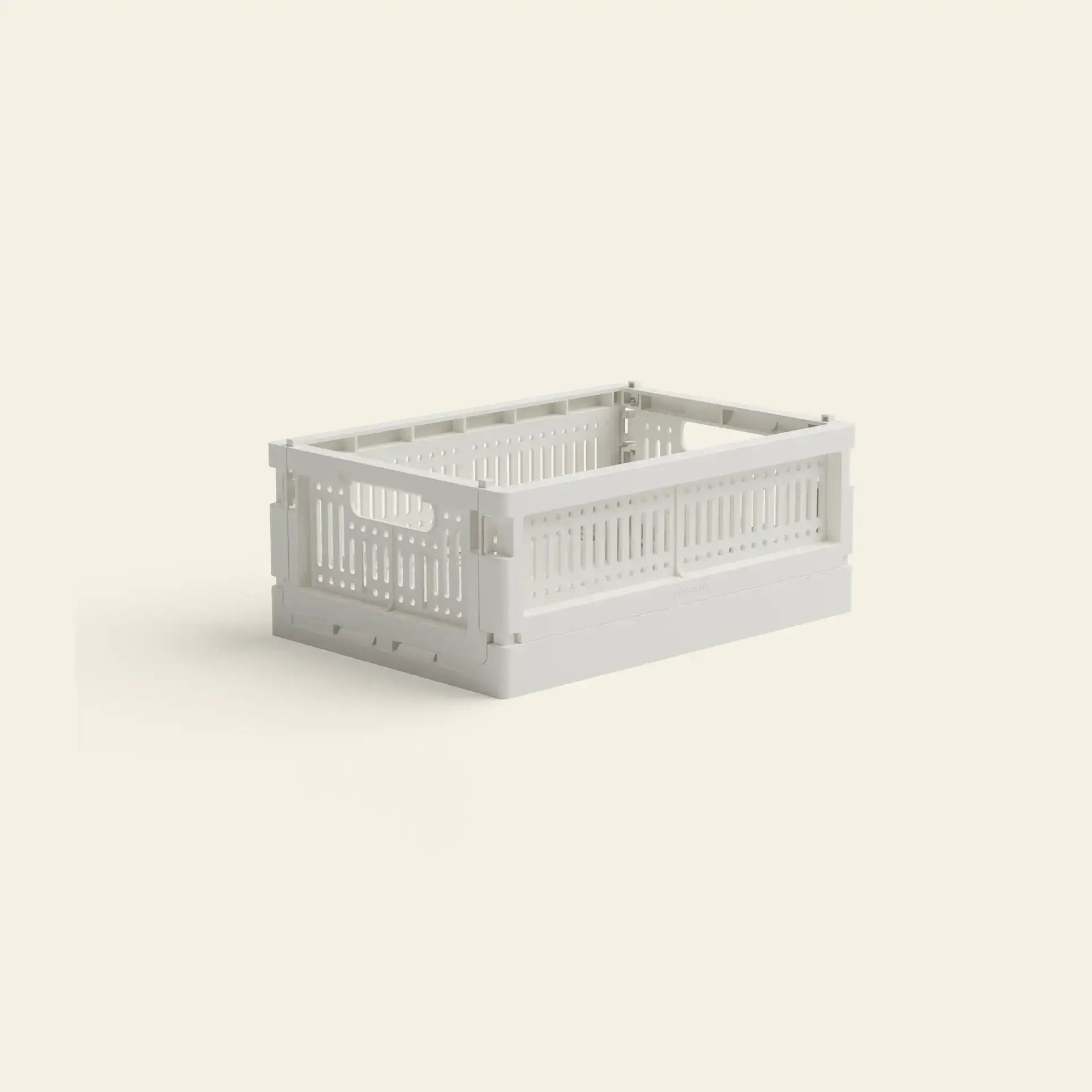The Made Crate Mini by Made Crate is a white recycled plastic rectangular storage crate featuring vented sides, handles, and stackable design, shown on a plain light background.