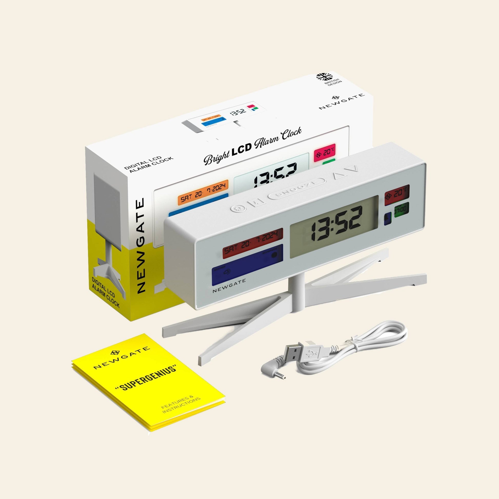 The Newgate Supergenius LCD Alarm Clock by Newgate, shown at 13:52, sits on its stand with a clear temperature display, alongside the packaging box, yellow instruction manual, and white USB power cable.