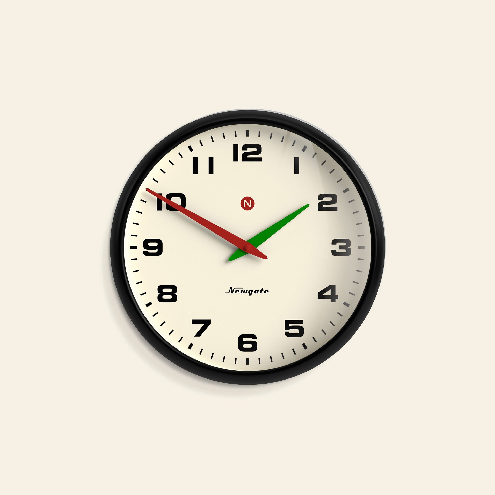 The Newgate Superstore Wall Clock by Newgate features a round black frame, cream-colored face with black numbers, and shows 10:10:39. Its black hour hand, green minute hand, and red second hand create a vintage retro look.