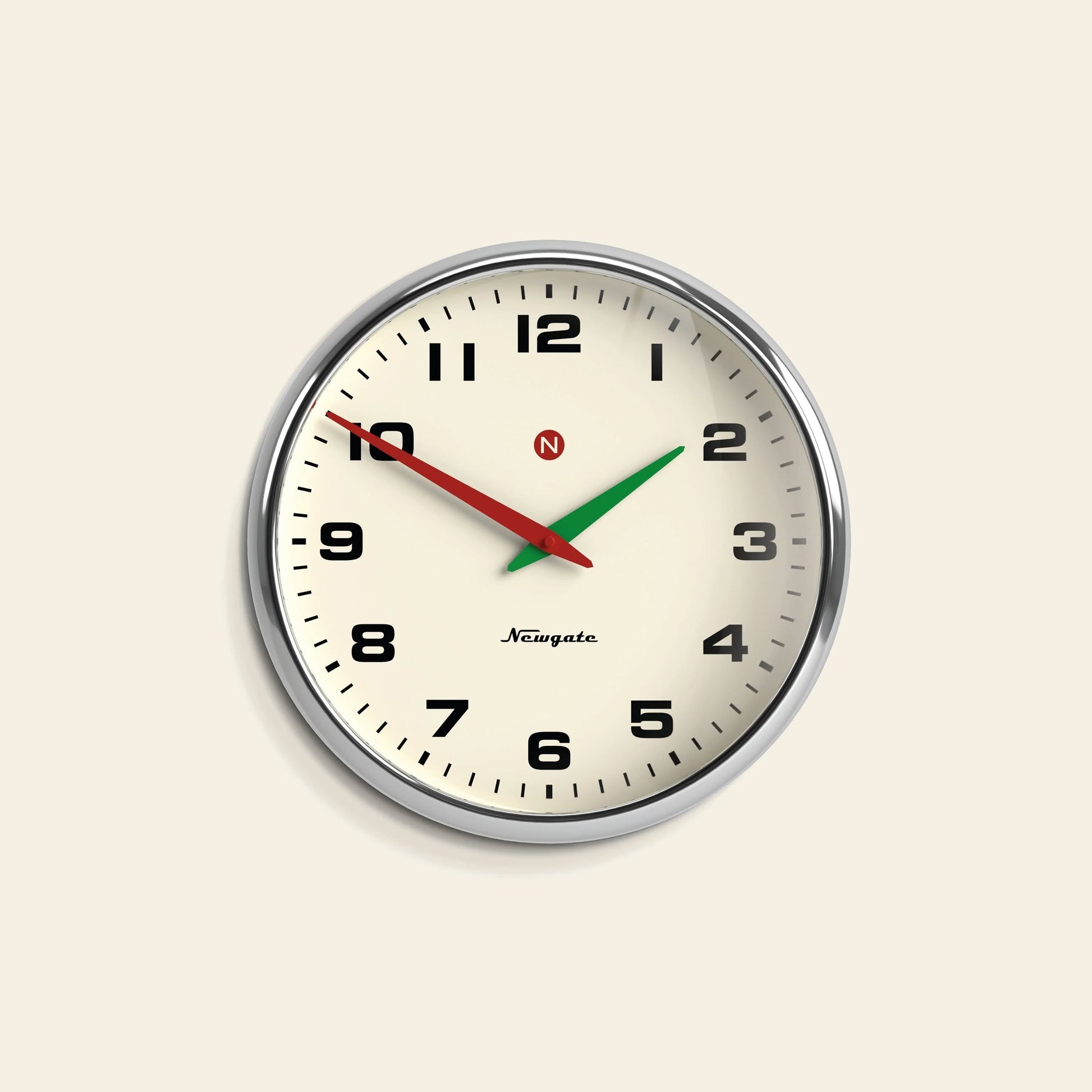 The Newgate Superstore Wall Clock by Newgate features a round retro design with a cream face, black numbers, black hands, a green second hand, and a silver rim. The clock displays the time as 2:48:50.