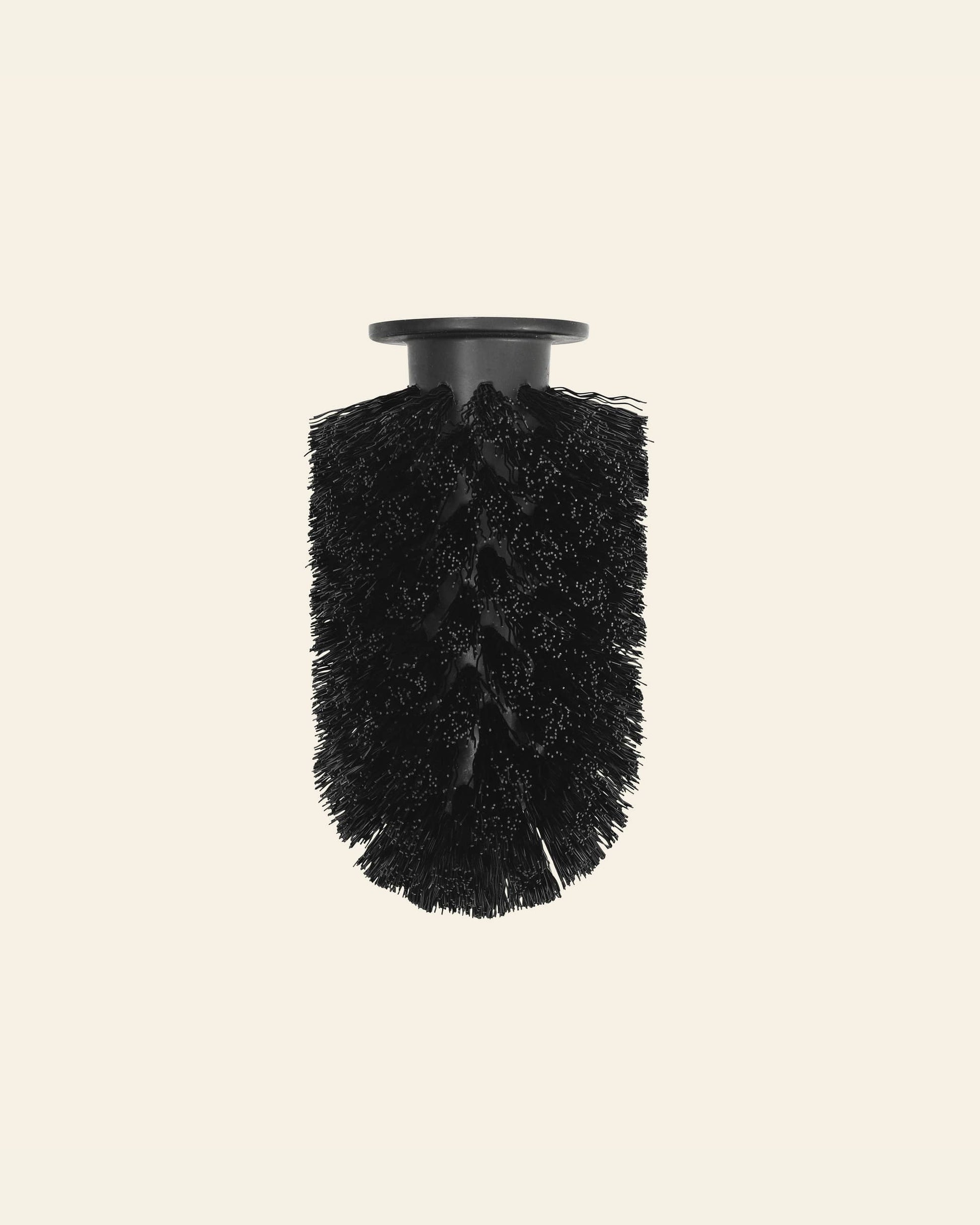 The Normann Copenhagen Ballo Brush Head, featuring dense bristles, stands upright against a plain light background—ideal for contemporary home cleaning.