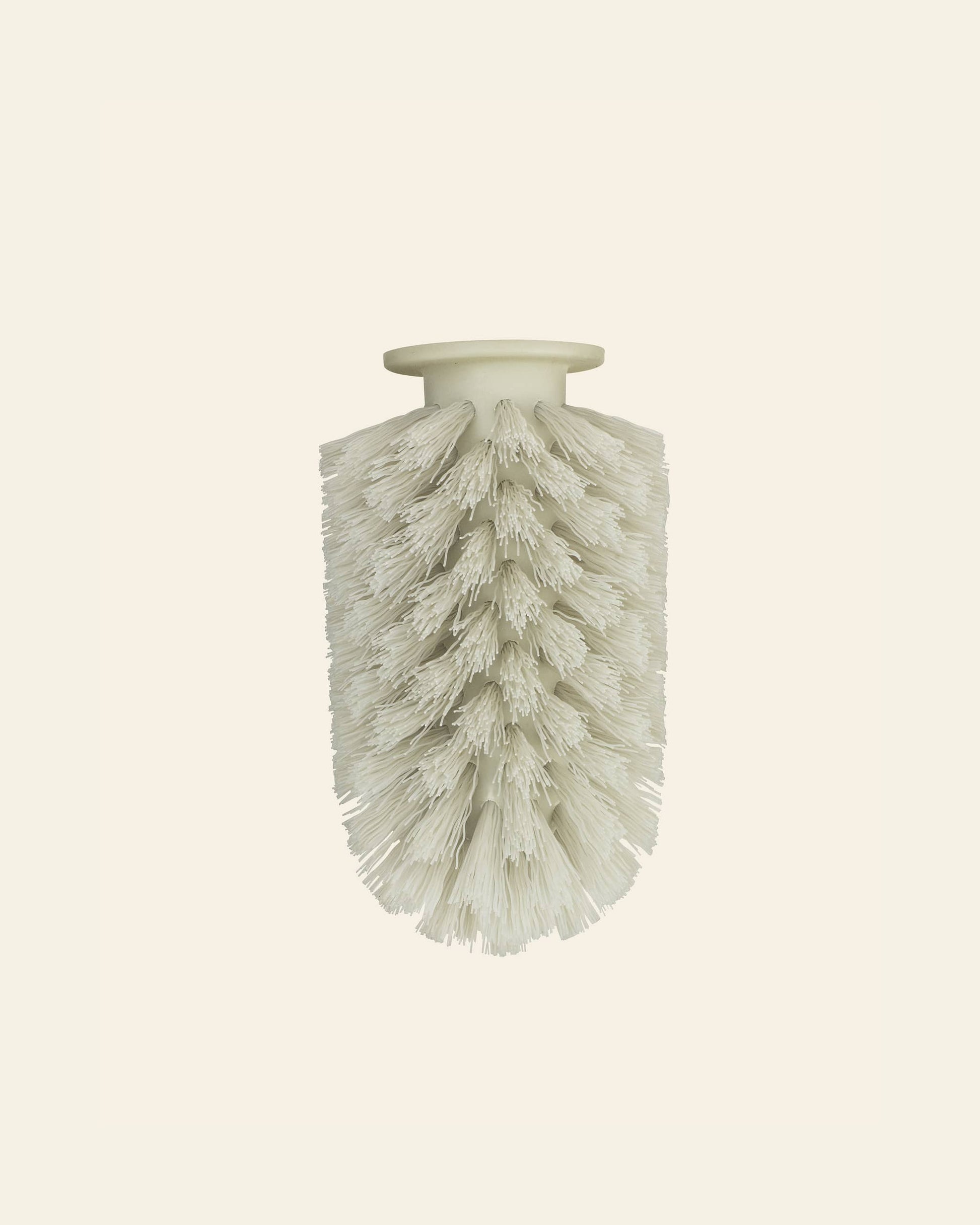 The Normann Copenhagen Ballo Brush Head by Normann Copenhagen features a white cylindrical design with densely packed bristles and a flat, round top, ideal for modern home cleaning, shown isolated on a plain light background.