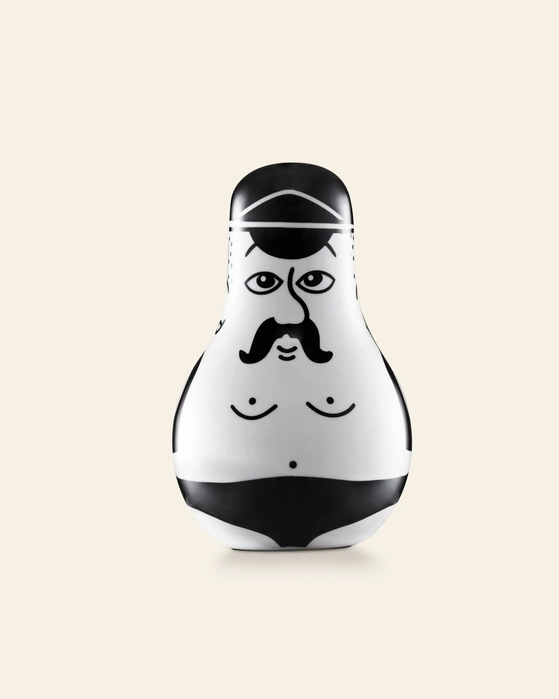 The Normann Copenhagen Friends Salt & Pepper Set features black and white nesting doll figurines shaped like cartoonish, mustachioed men—an ideal, playful gift for fans of unique decor.