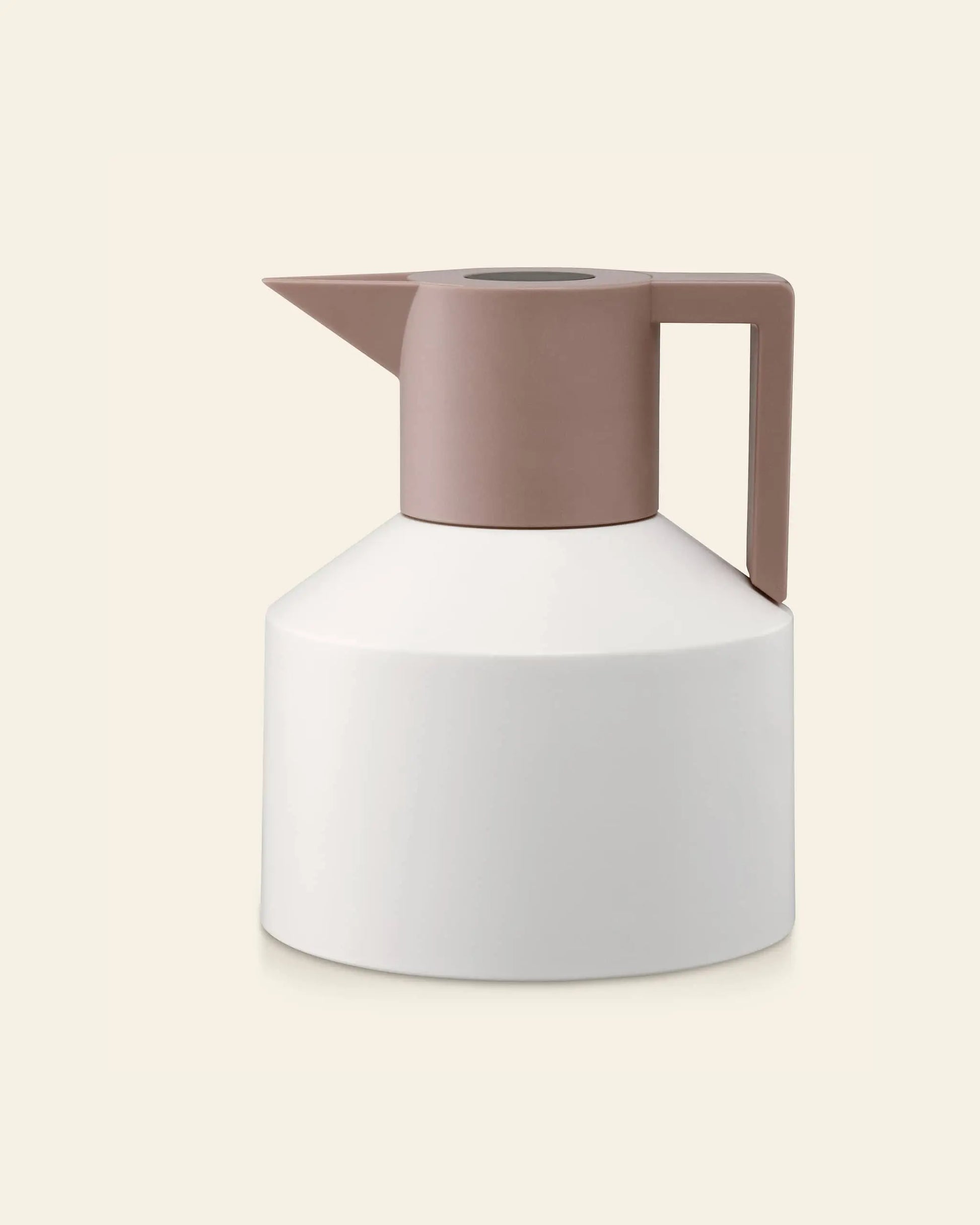The Normann Copenhagen Geo Vacuum Jug is a modern, minimalist white vacuum-insulated jug with a wide base and taupe handle and lid, shown against a plain light beige background.