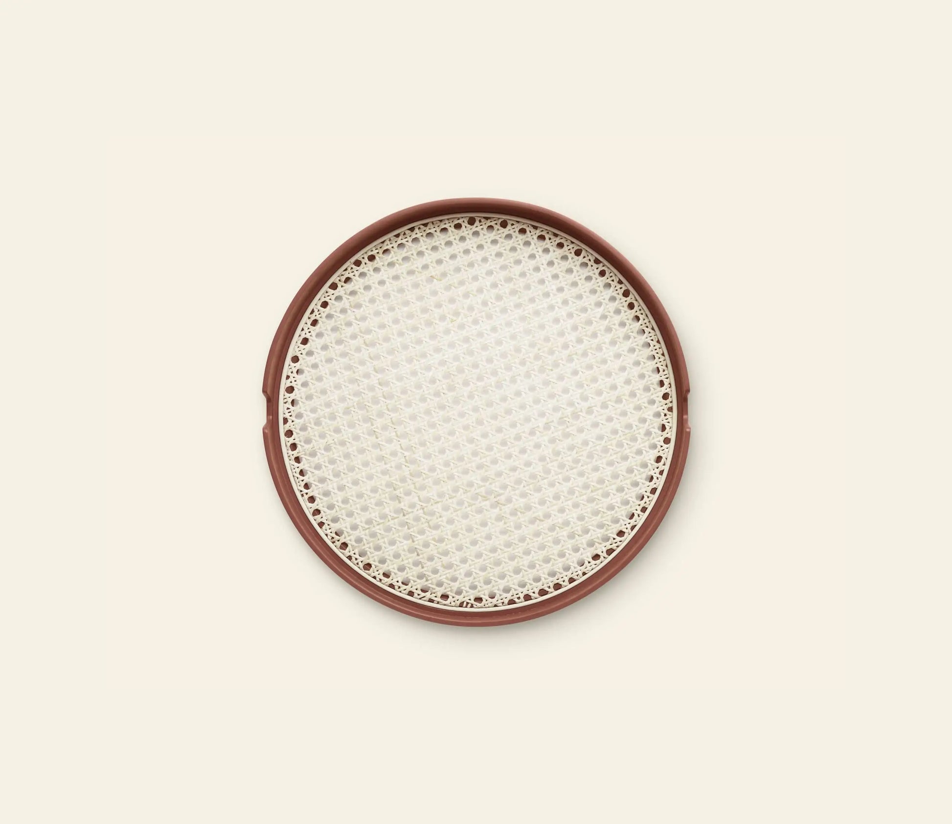 The Normann Copenhagen Salon Tray, 40cm, by Normann Copenhagen features a round design with a brown rim and woven white mesh surface, elegantly displayed on a light beige background.