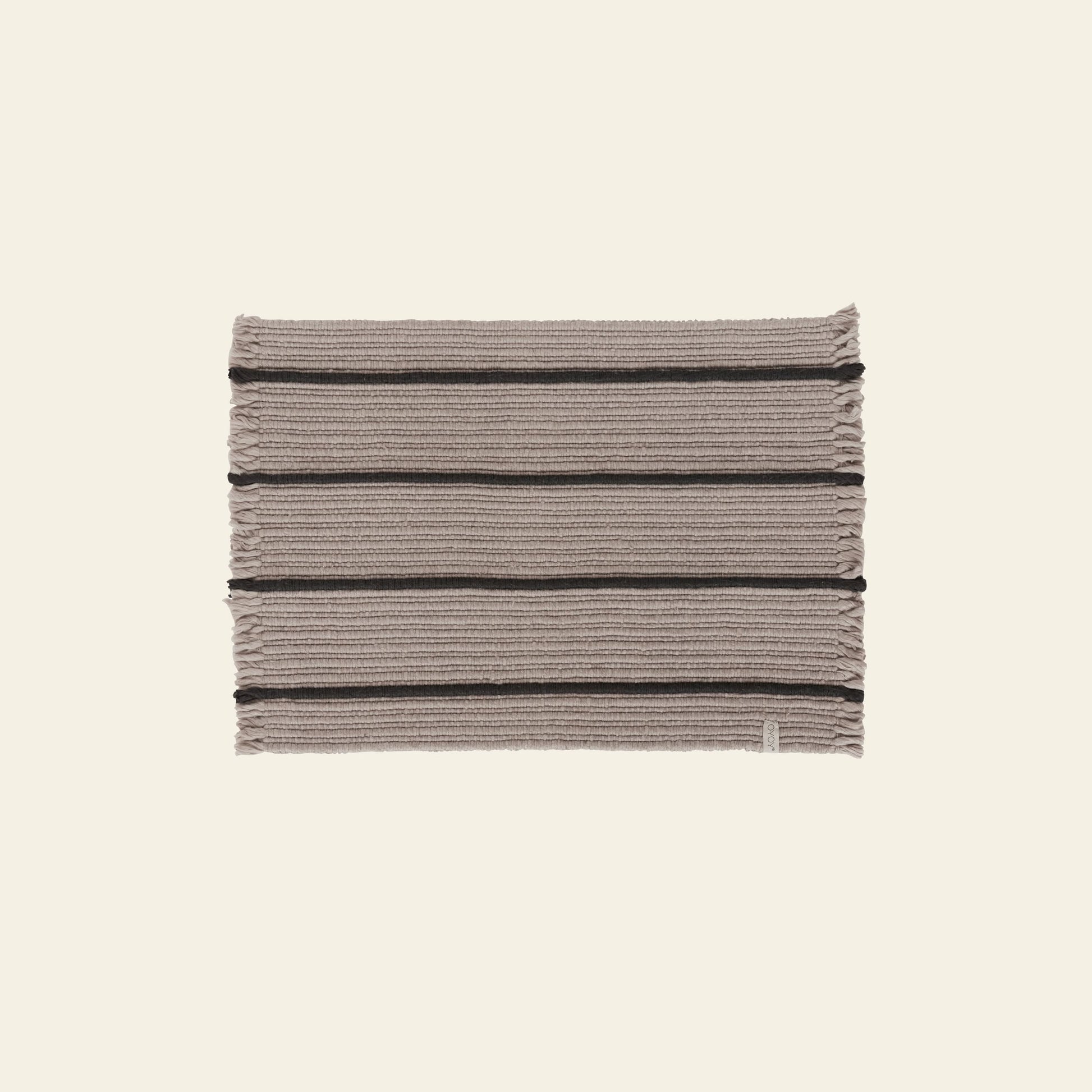 The OYOY Living Design Putki Recycled Doormat by OYOY Living Design features horizontal dark and light beige stripes, short-edge fringe, and is crafted from recycled materials. It is shown on a plain light background.