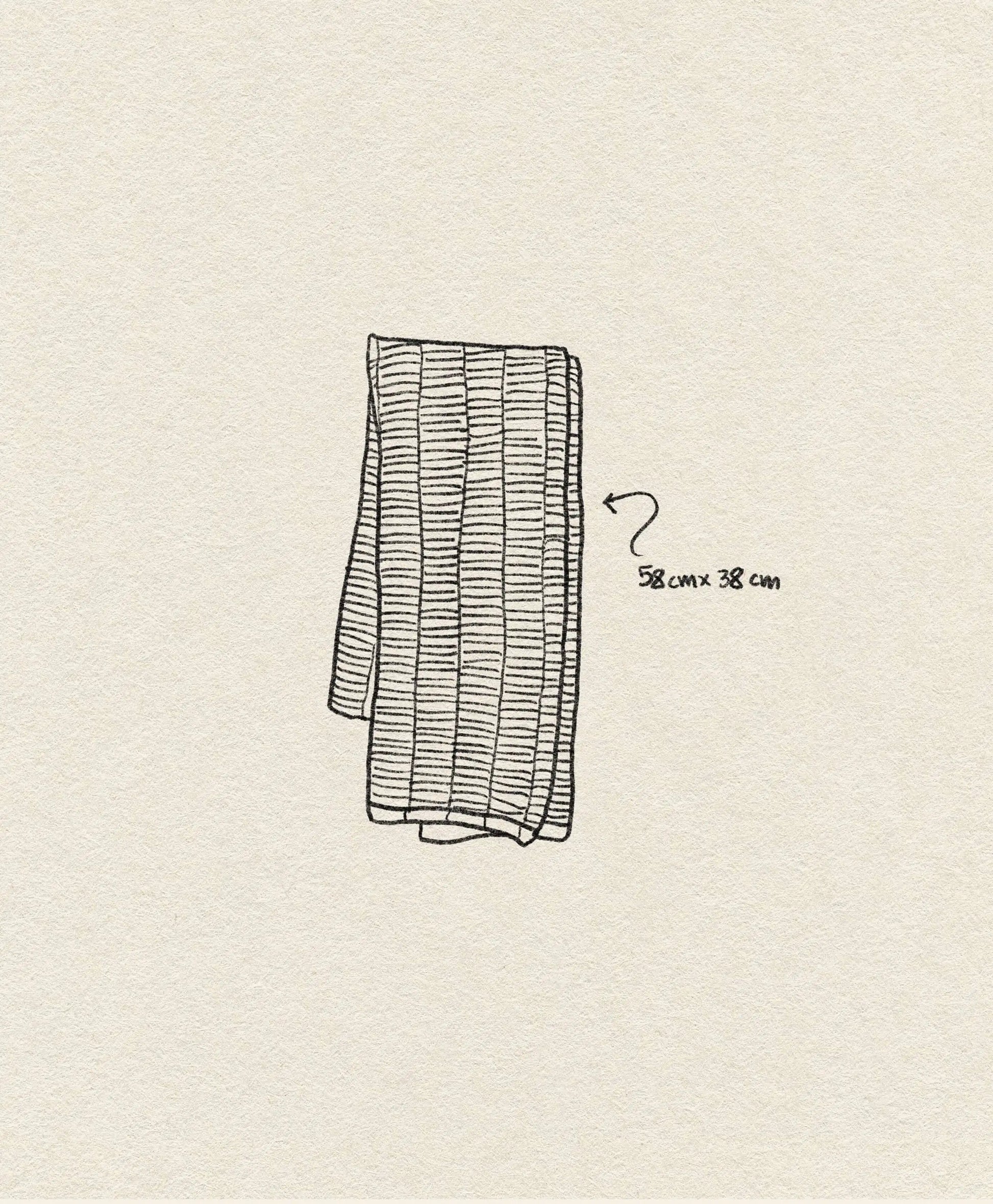 A simple line drawing of the OYOY Living Design Stringa Mini Towel—folded, rectangular, knitted organic cotton with horizontal lines, labeled 58 cm x 38 cm—shown on a beige textured background.