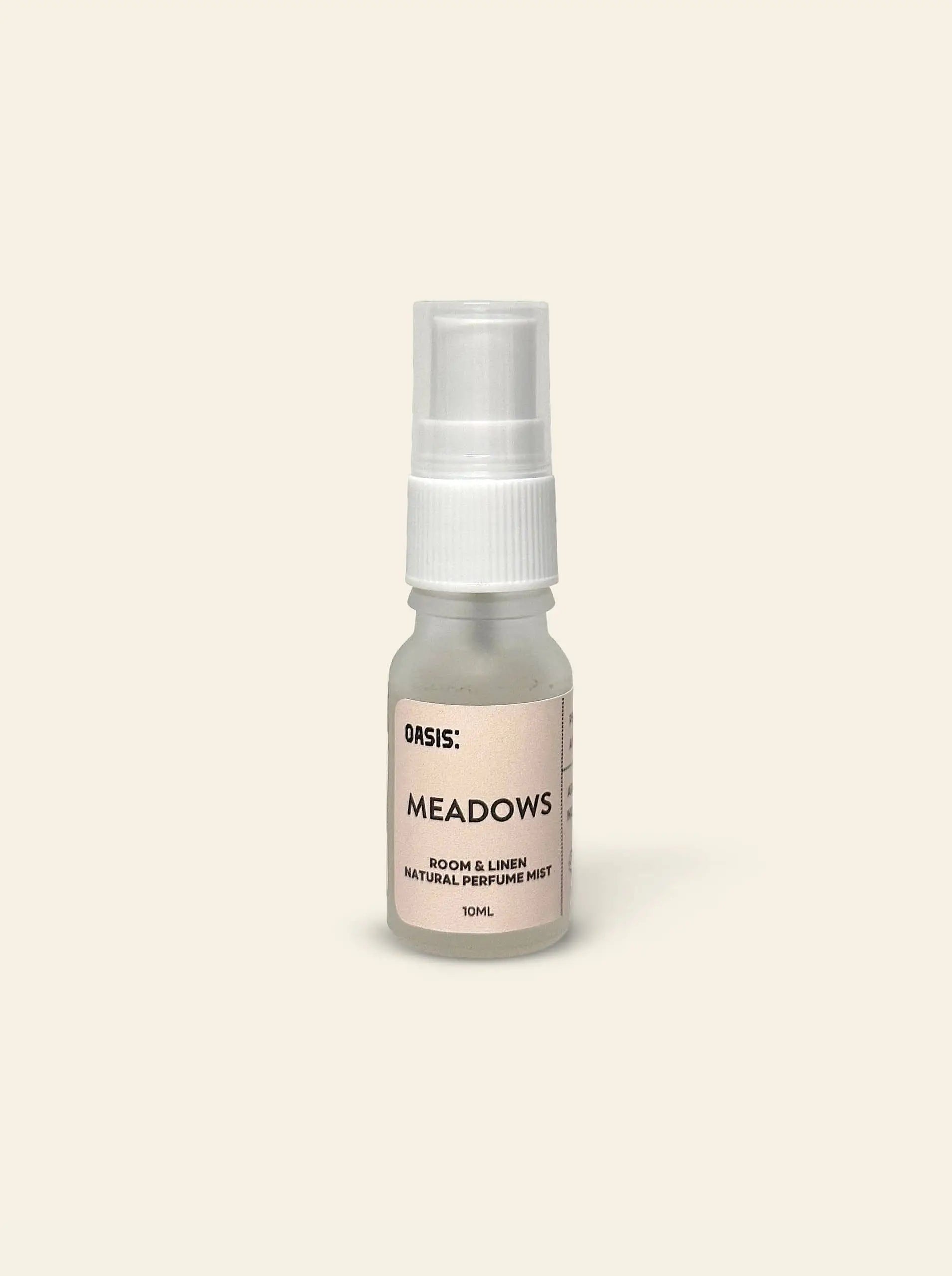 A 10ml spray bottle of Oasis Beauty Kitchen Room and Linen Mist by Oasis Beauty Kitchen rests on a plain, light beige background, offering a perfume-grade mist with fresh linen notes for a clean, inviting ambiance.