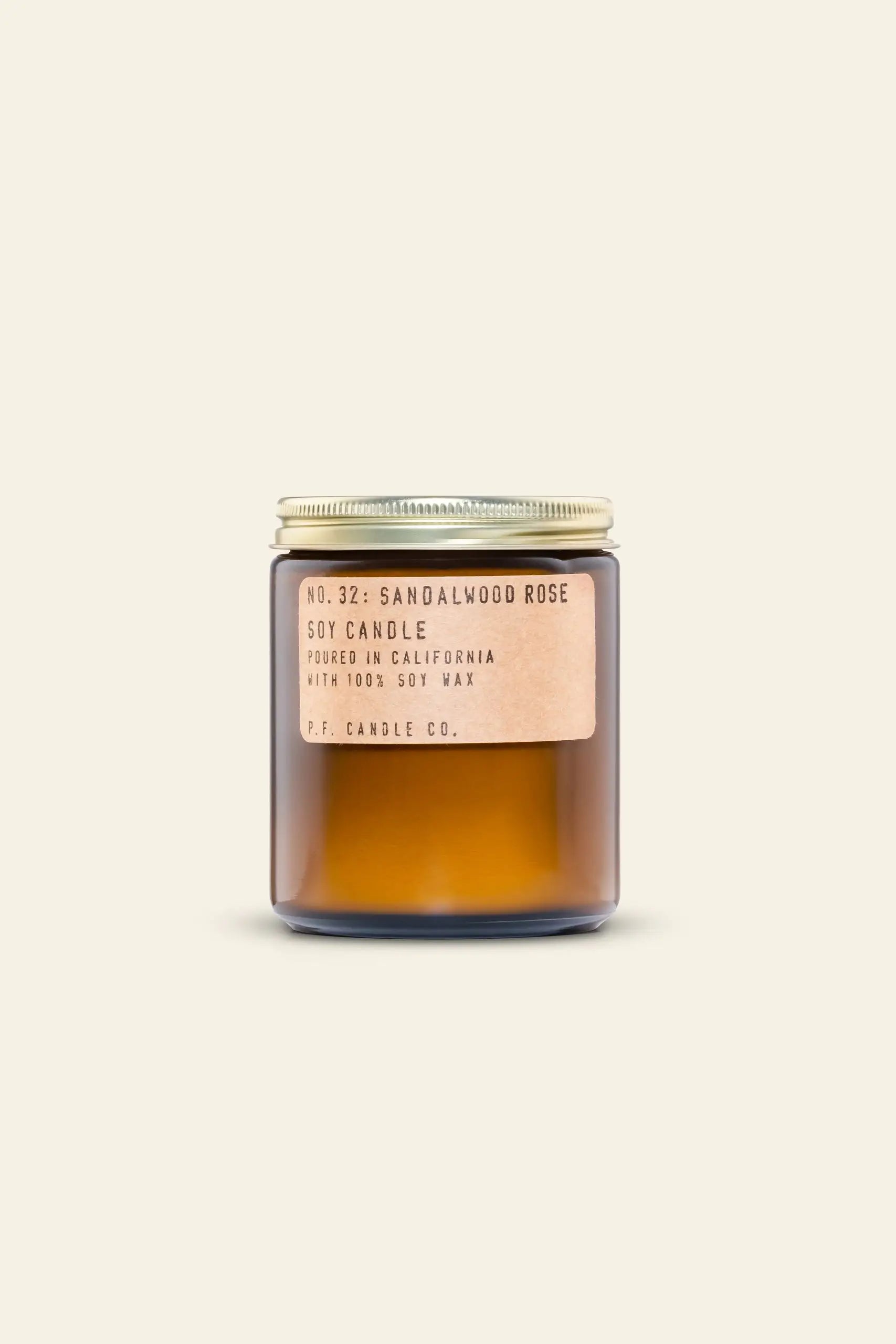 P.F. Candle Co. No. 32 Sandalwood Rose 7.2 oz Soy Candle features a brown glass jar with a gold metal lid and tan label, highlighting this hand-poured, 100% soy wax candle by P.F. Candle Co., made in California.