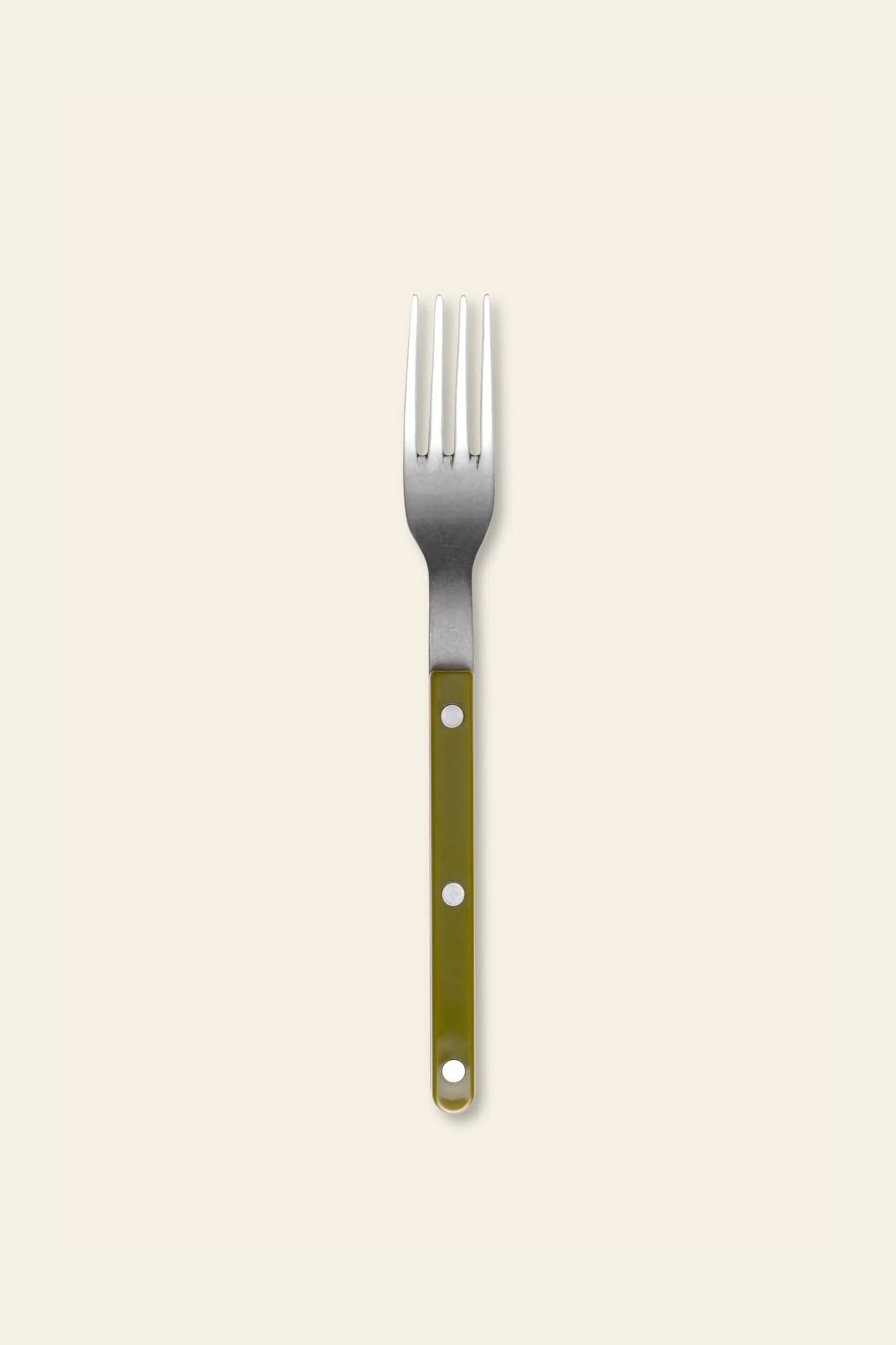 The Sabre Bistrot Vintage Dinner Fork by Sabre features a green handle with three white dots and a stainless steel head, displayed on a plain light beige background.