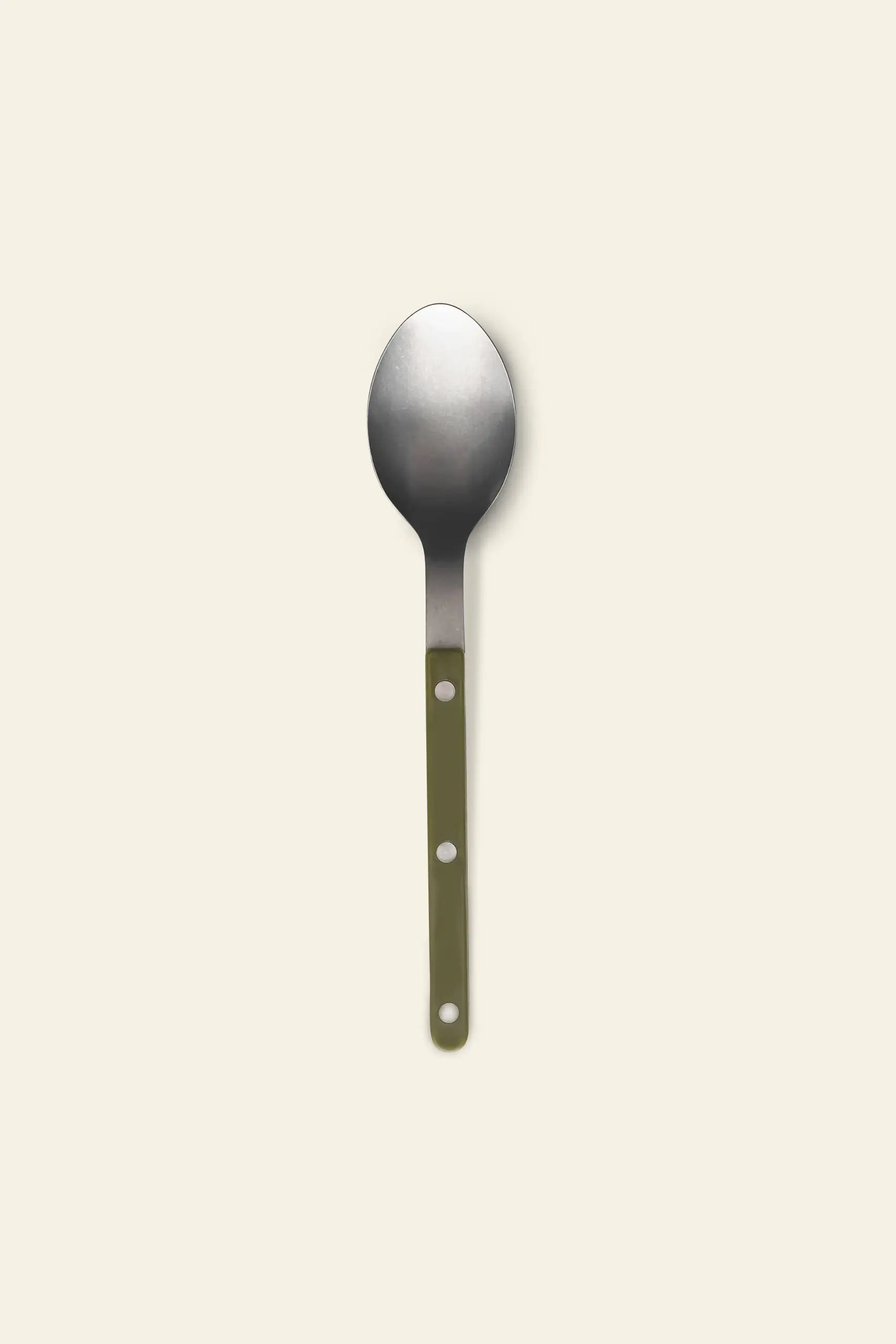 The Sabre Bistrot Vintage Soup Spoon by Sabre features a flat green handle with two circular holes, crafted from stainless steel and shown on a light beige background—capturing French cafe charm.