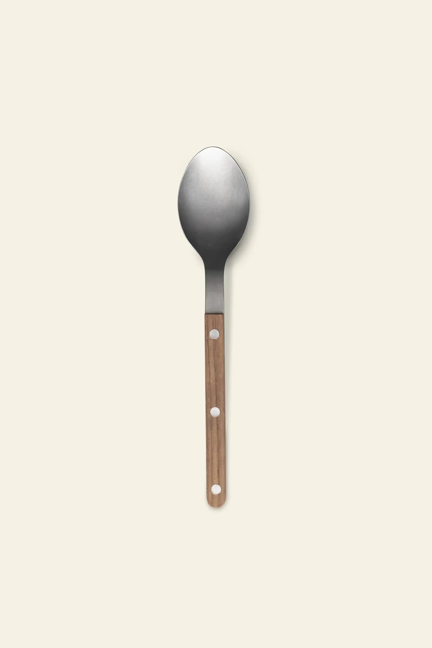 The Sabre Bistrot Vintage Soup Spoon by Sabre features a wide, rounded stainless steel bowl and a wooden handle with three circular holes, displayed on a plain light background.