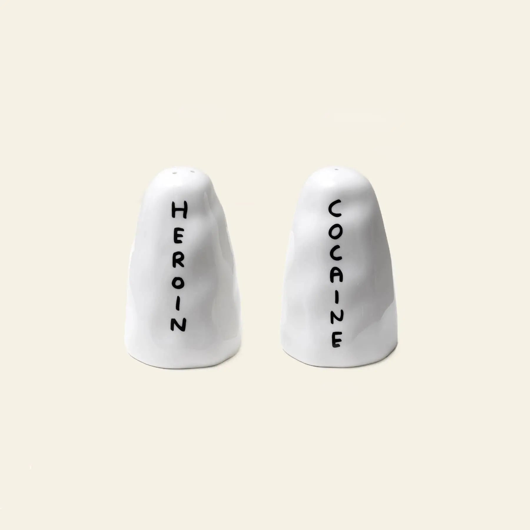 The Shrig Shop Heroin and Cocaine Porcelain Shakers by Shrig Shop are quirky white collectibles labeled with bold text—perfect for making a statement.