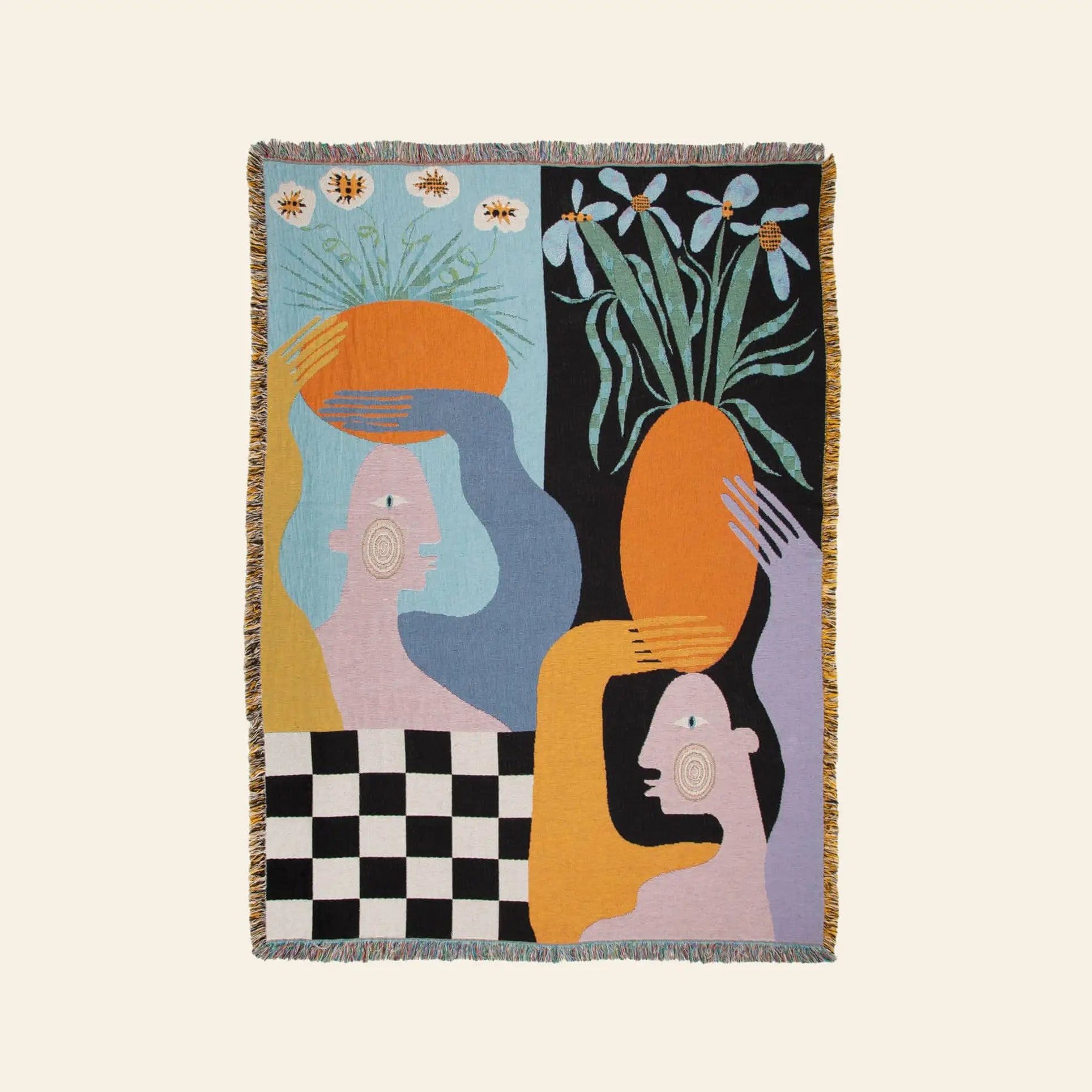 The Slowdown Studio Moretti Throw by Slowdown Studio is a colorful tapestry made from recycled cotton, featuring pastel abstract human figures, one with an orange vase of white flowers, on a black, yellow, and checkered background with fringe edges.