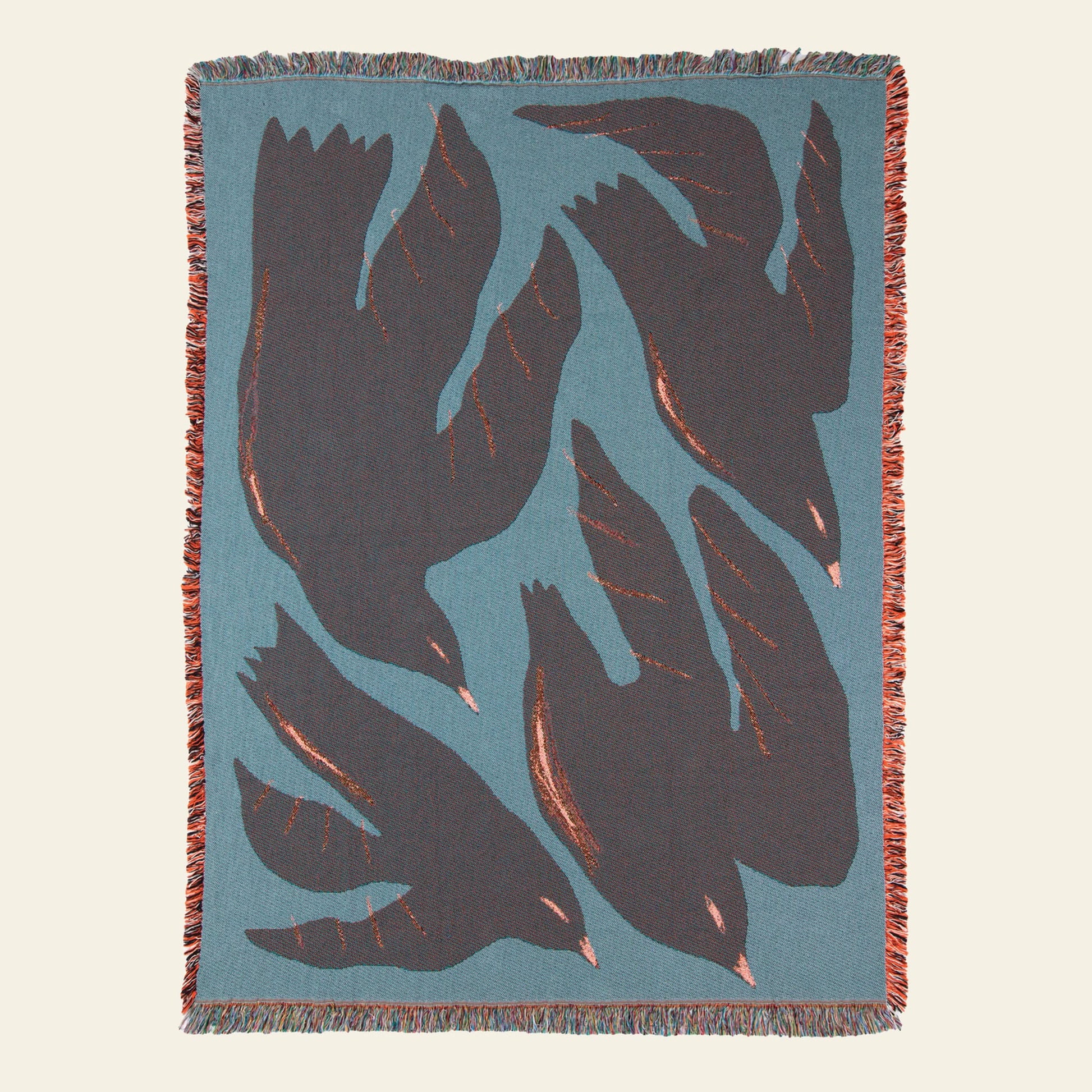 The Slowdown Studio Passaro Throw is a woven blanket with a blue background, displaying four bold black birds in flight. Made from recycled cotton by Slowdown Studio, it features multicolored fringe for an eco-friendly, stylish look.