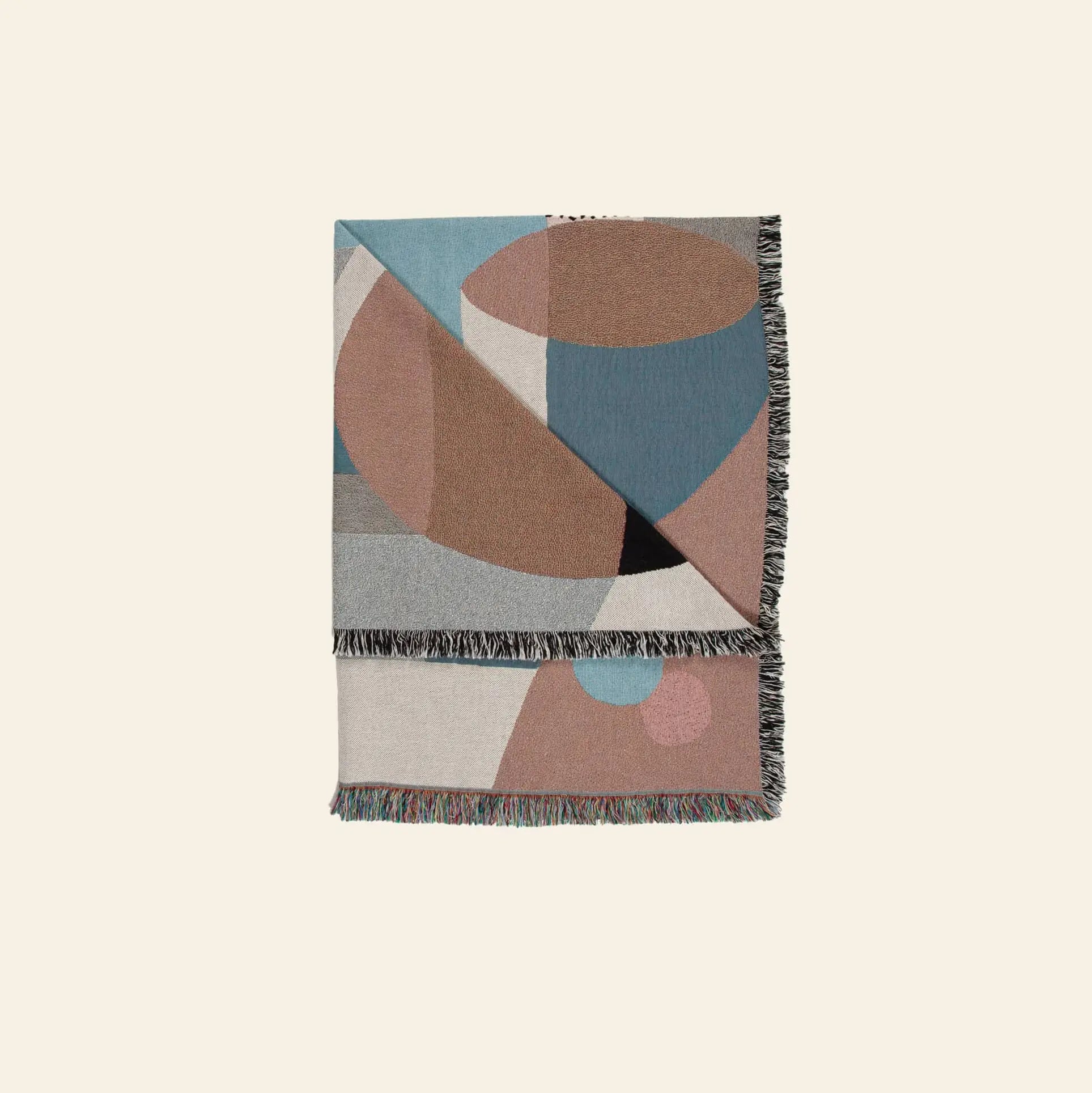 The Slowdown Studio Pollard Throw by Slowdown Studio is a recycled cotton woven blanket with fringe edges and a geometric design in muted blue, brown, beige, and gray—eco-friendly style meets modern comfort.