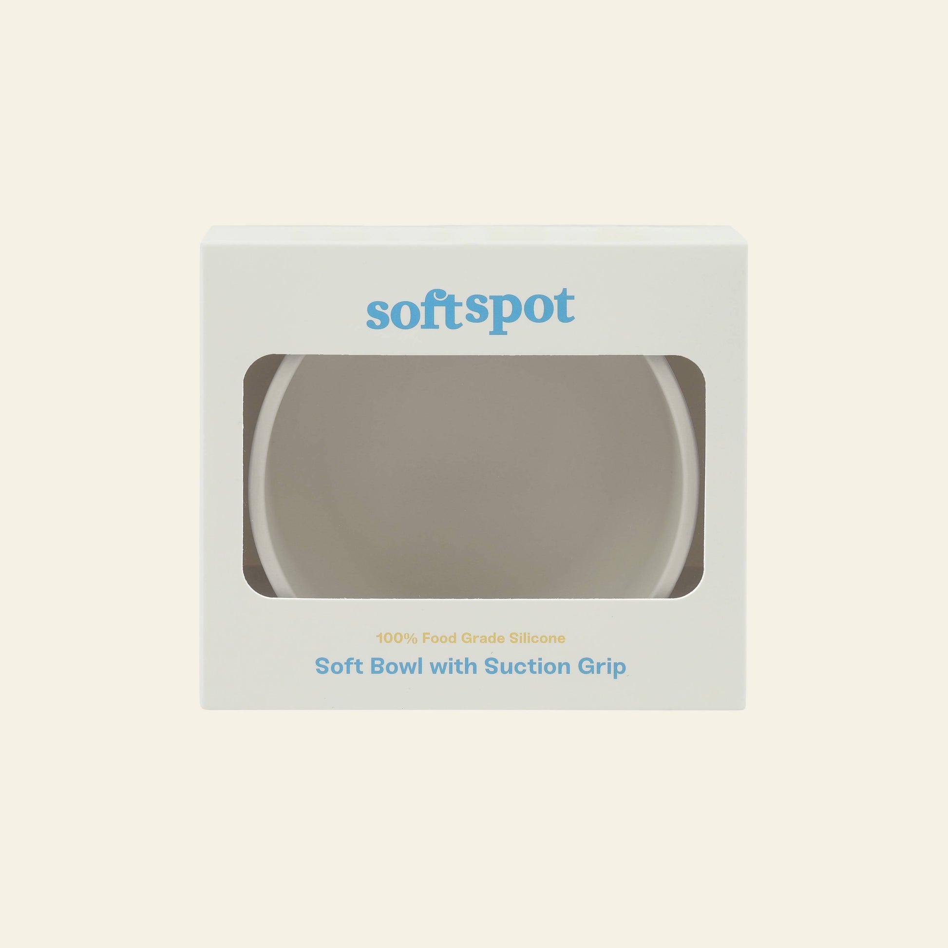 A white Soft Spot Soft Suction Bowl is packaged in a box with a clear window. The box displays Soft Spot on top and features Soft Bowls with Suction Grip and 100% food-grade silicone in blue and yellow text.