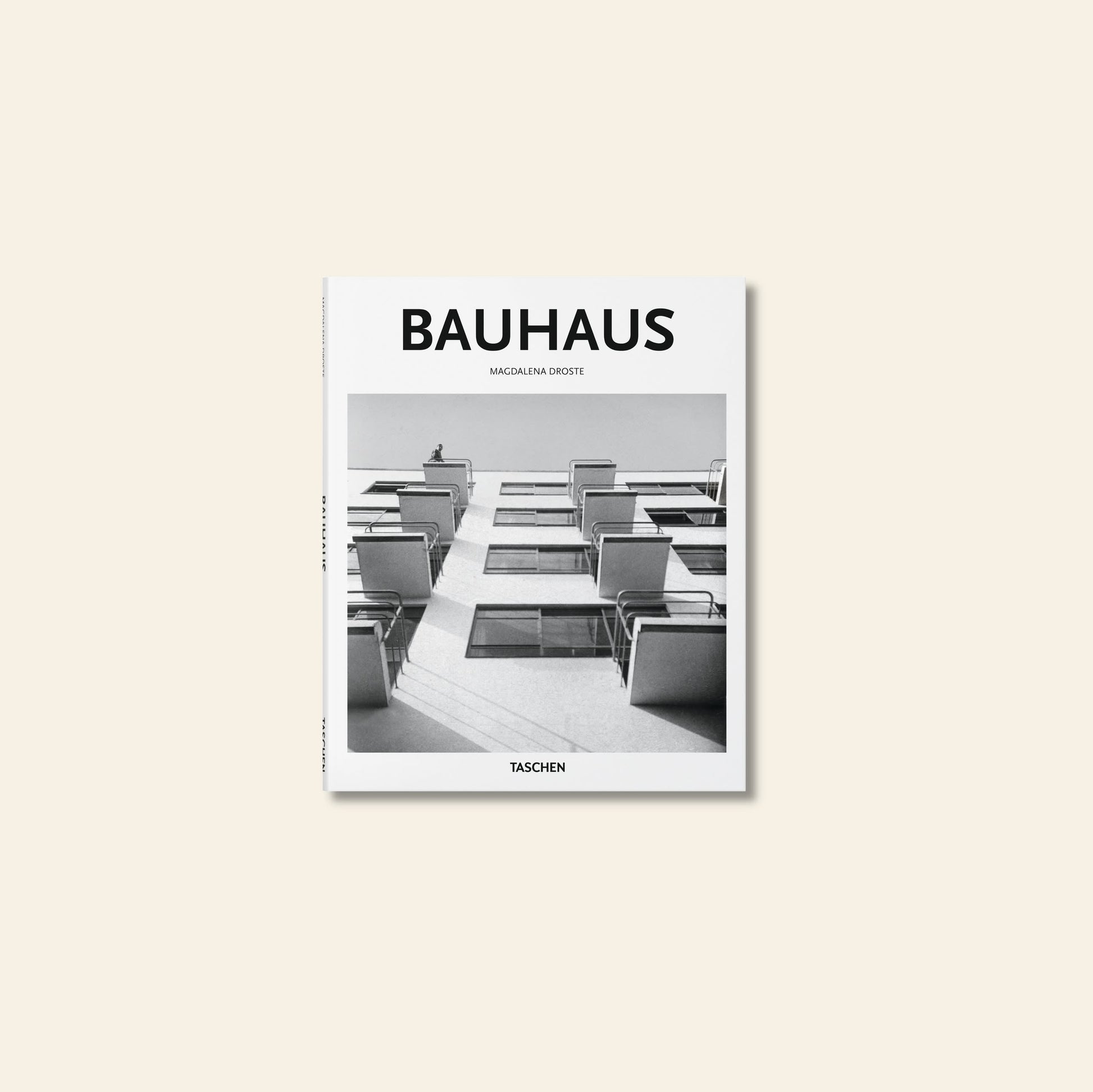TASCHEN Bauhaus, published by TASCHEN, features a black-and-white cover image of modernist balconies, symbolizing the Bauhaus schools influence on creative expression. The publishers name appears at the bottom.
