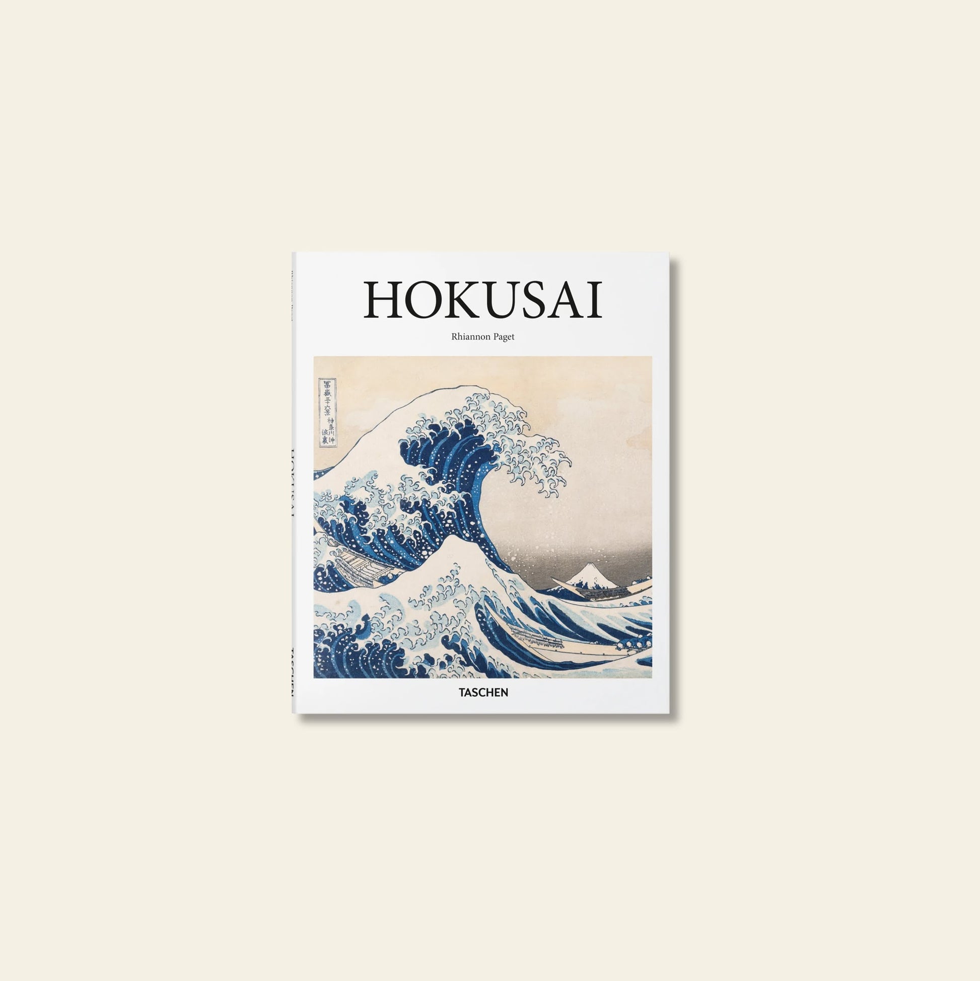 The TASCHEN Hokusai book cover by TASCHEN honors Japanese art, showcasing Katsushika Hokusai’s iconic The Great Wave off Kanagawa with its dramatic blue wave and Mount Fuji in the distance.