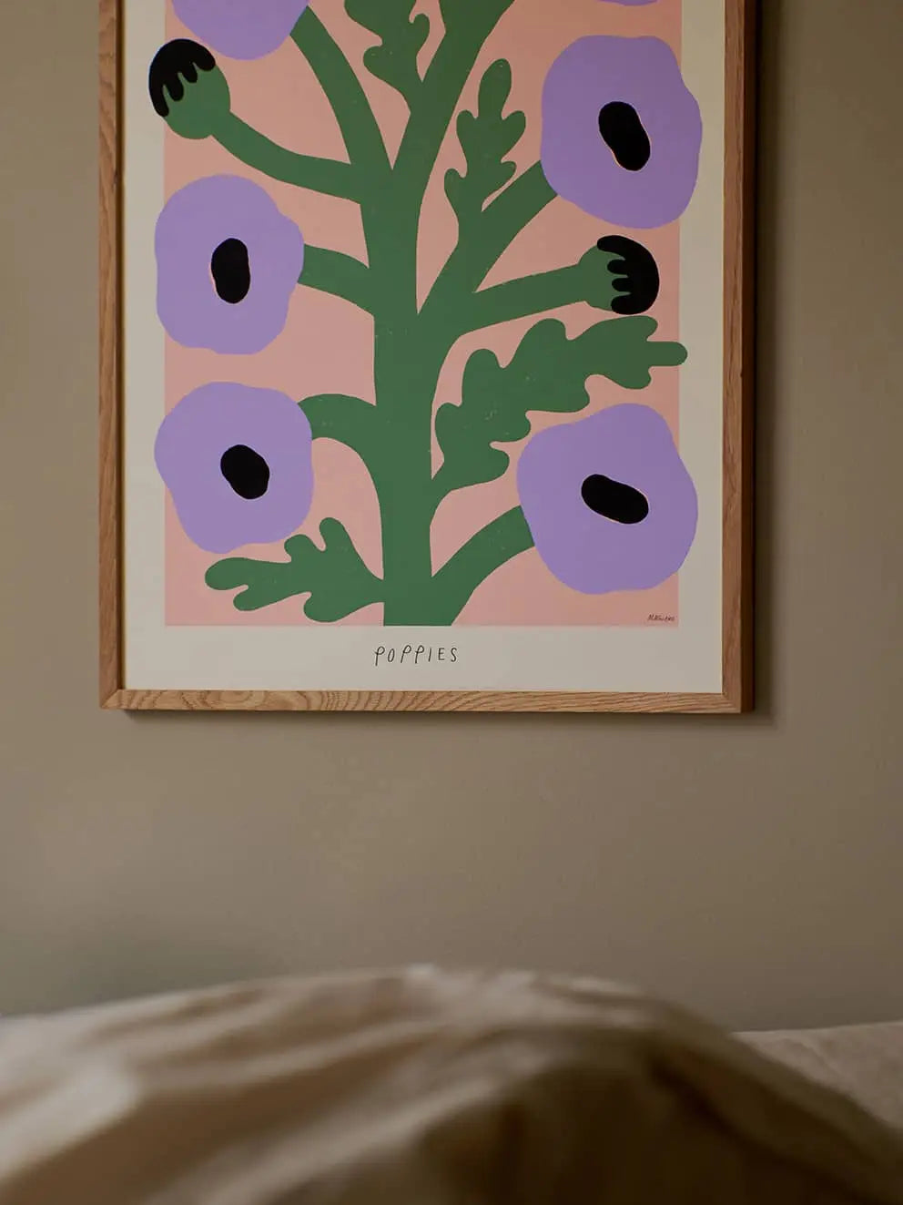 The Poster Club’s Madelen Möllard - Flowers in Blue Vase (50x70) art print showcases stylized blooms in a blue vase, blending soft tones for a modern look. This print is from The Poster Club collection.