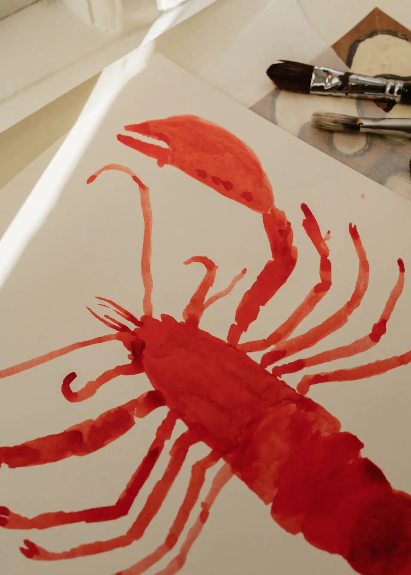 The Poster Club Marina García Fernández - Langosta (30x40) is a watercolor art print featuring a red lobster, inspired by Marina García Fernández and crafted in The Poster Clubs signature style.