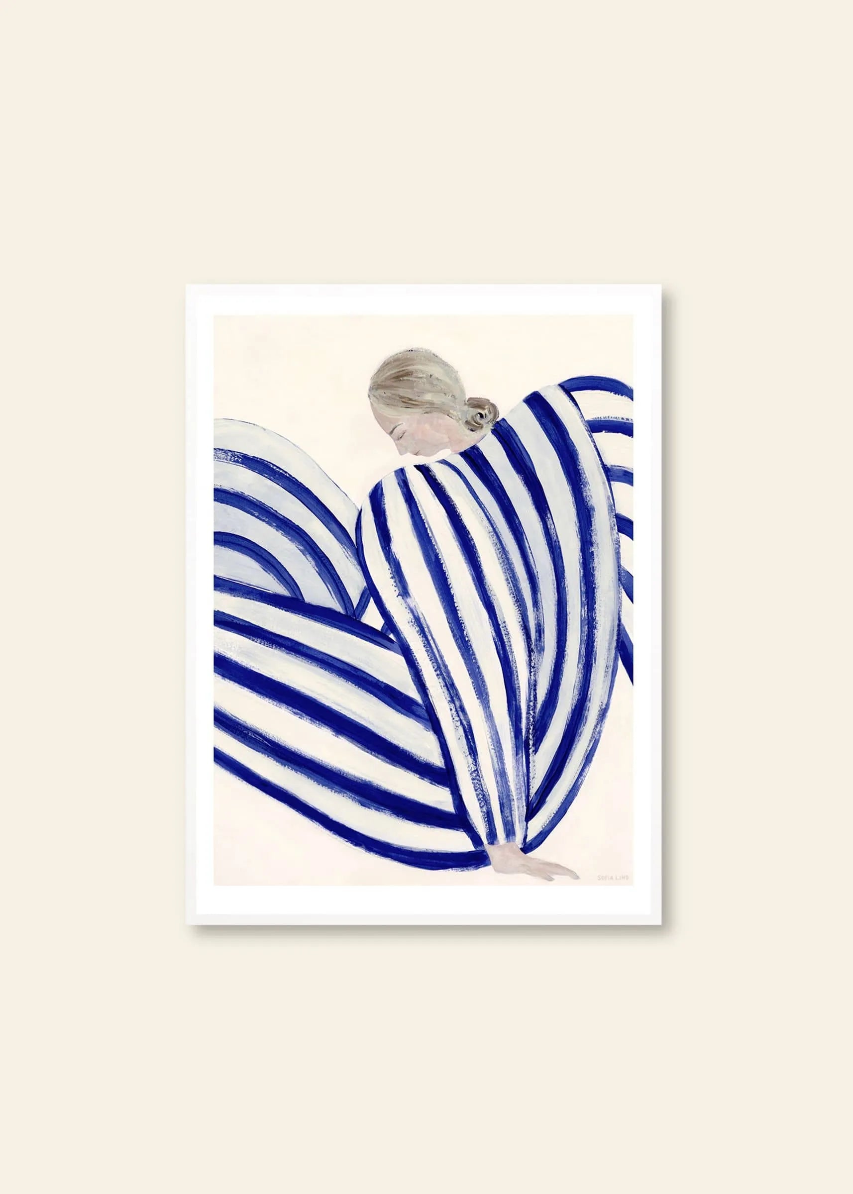 Sofia Lind - Blue Stripe At Concorde (30x40) by The Poster Club features a blonde figure in bold blue and white stripes, set on beige. Part of the Paris Metro Collection, available as a giclée print in a white frame.