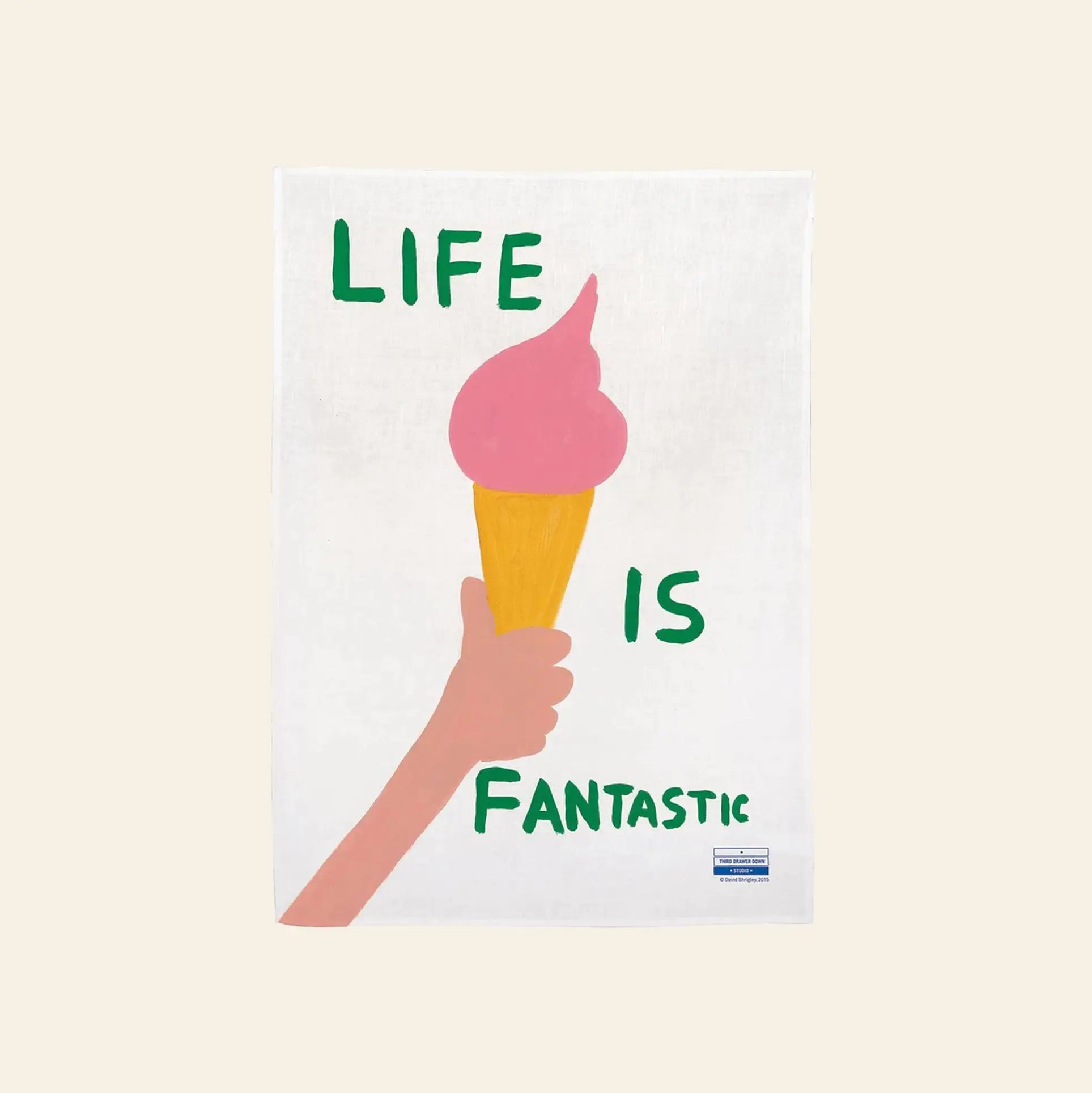 The Third Drawer Down David Shrigley - Life Is Fantastic Tea Towel features a quirky illustration of a pink ice cream cone held by a hand, with LIFE IS FANTASTIC in bold green and blue, inspired by David Shrigleys signature style.