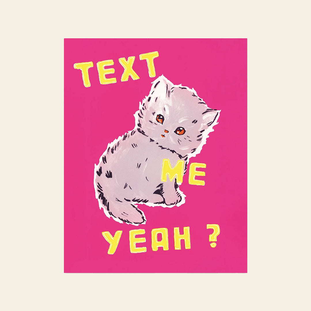 The Third Drawer Down Text Me Yeah Tea Towel features Magda Archers whimsical art of a cute grey kitten with orange eyes on a pink background, surrounded by bold yellow TEXT ME YEAH? text in a playful font.
