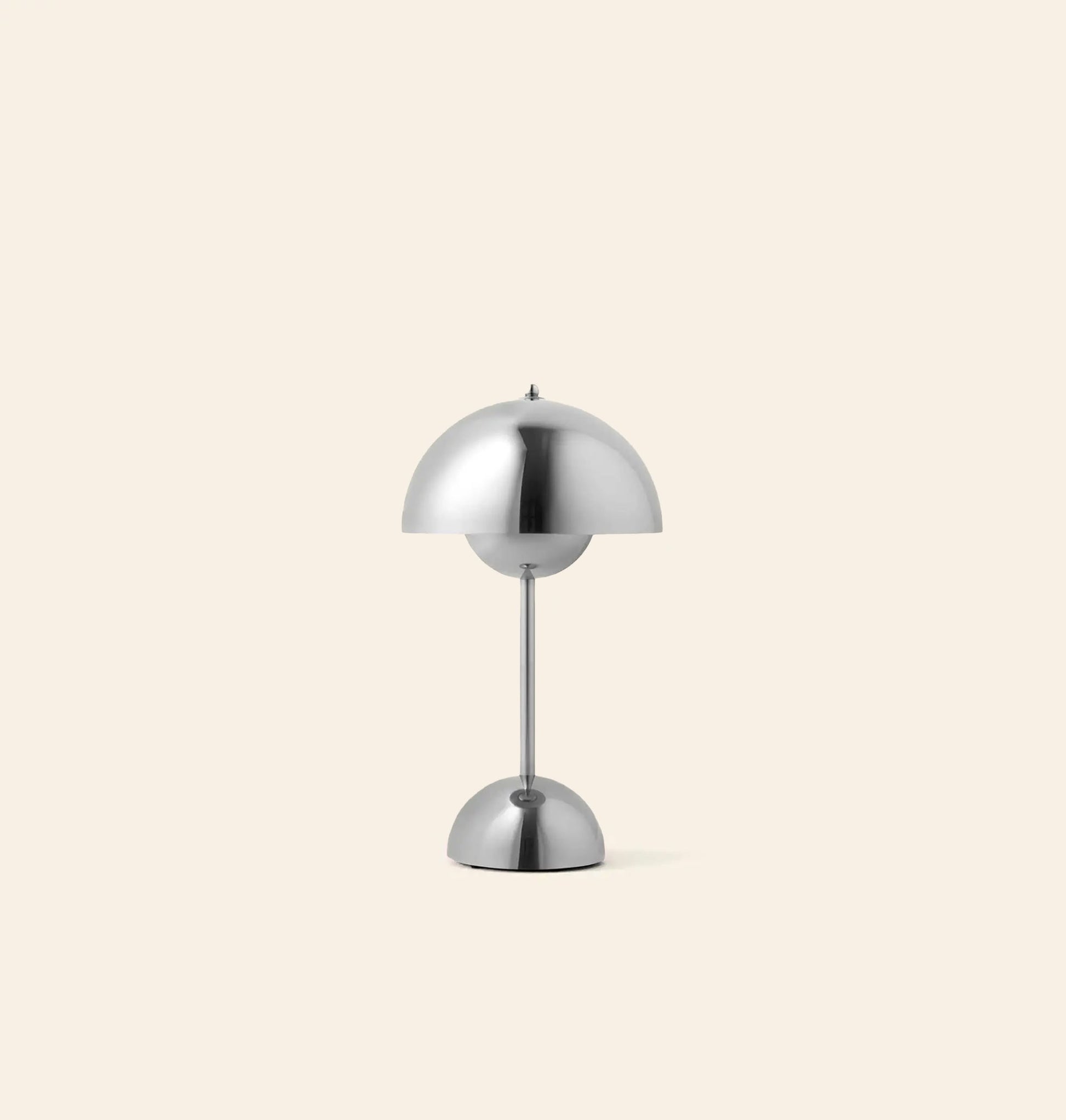 The &Tradition Flowerpot VP9 Portable Table Lamp features a modern silver dome-shaped shade and base on a simple pole, set against a light beige background, and includes a USB charging cable for convenience.