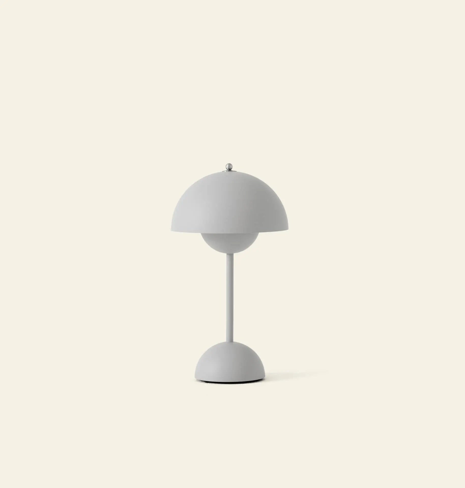 The &Tradition Flowerpot VP9 Portable Table Lamp features a dome-shaped shade and base in smooth light gray, set against an off-white background, and includes a USB charging cable for convenience.