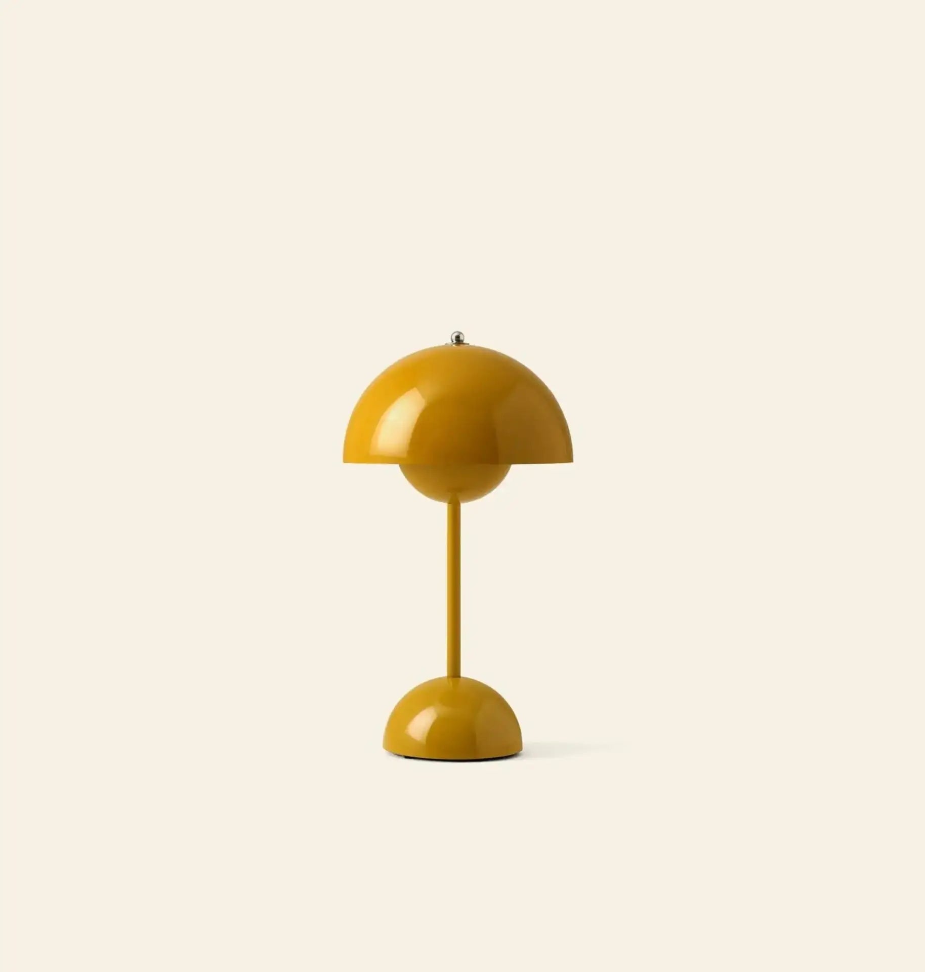 The &Tradition Flowerpot VP9 Portable Table Lamp by &Tradition is a yellow, dome-shaped lamp with a modern, minimalist design and rounded base, shown on a light beige background, and comes with a USB charging cable for easy use.